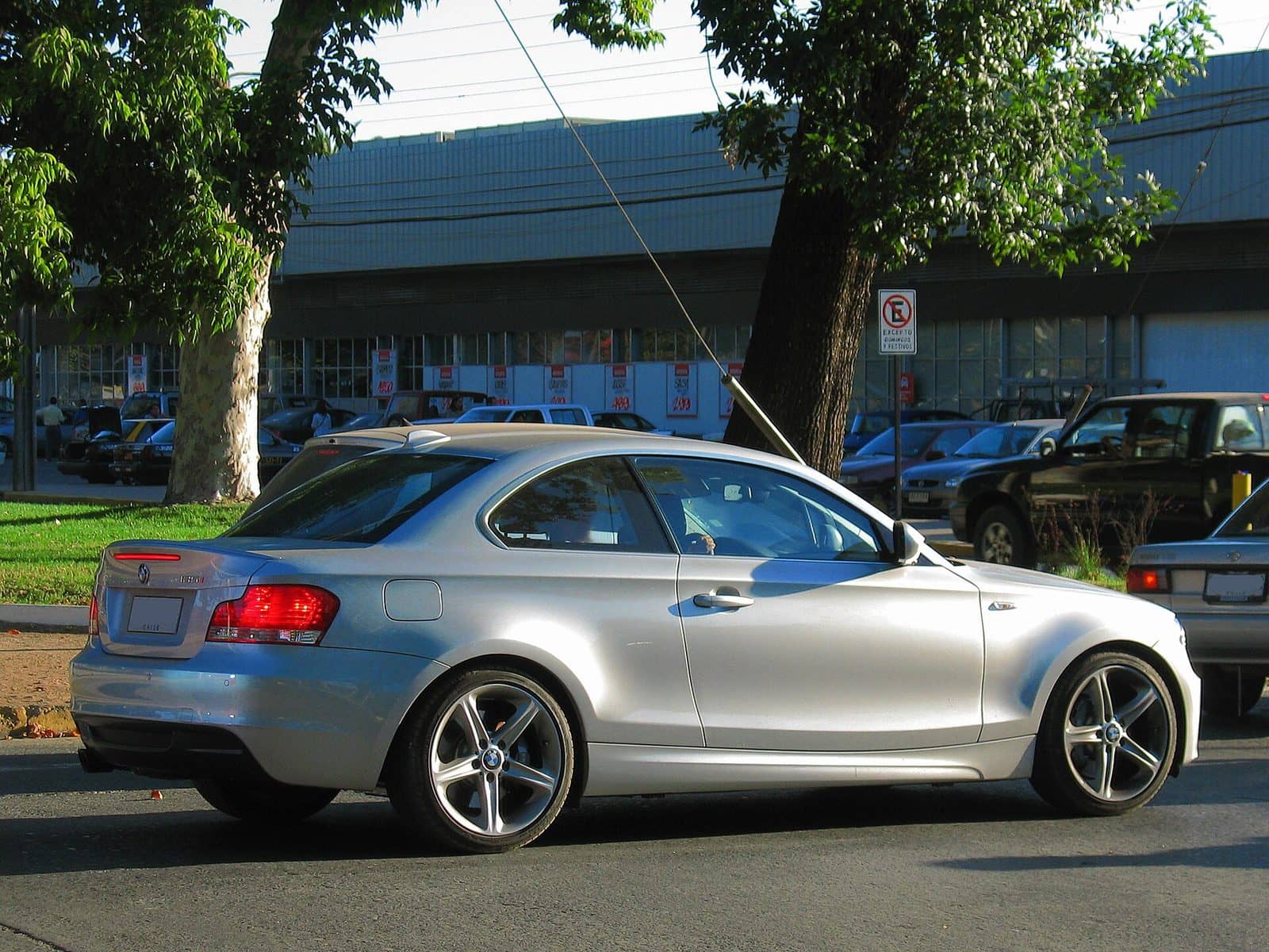 Silver BMW 135i coupé, rear three-quarter view