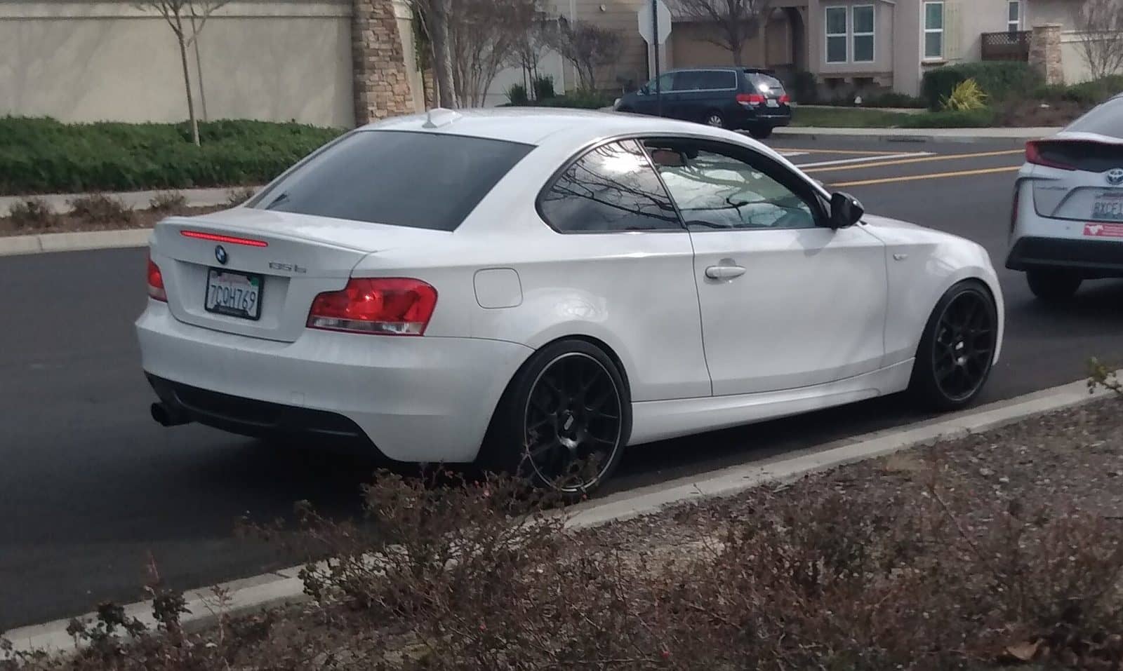White BMW 135is coupé, rear three-quarter view