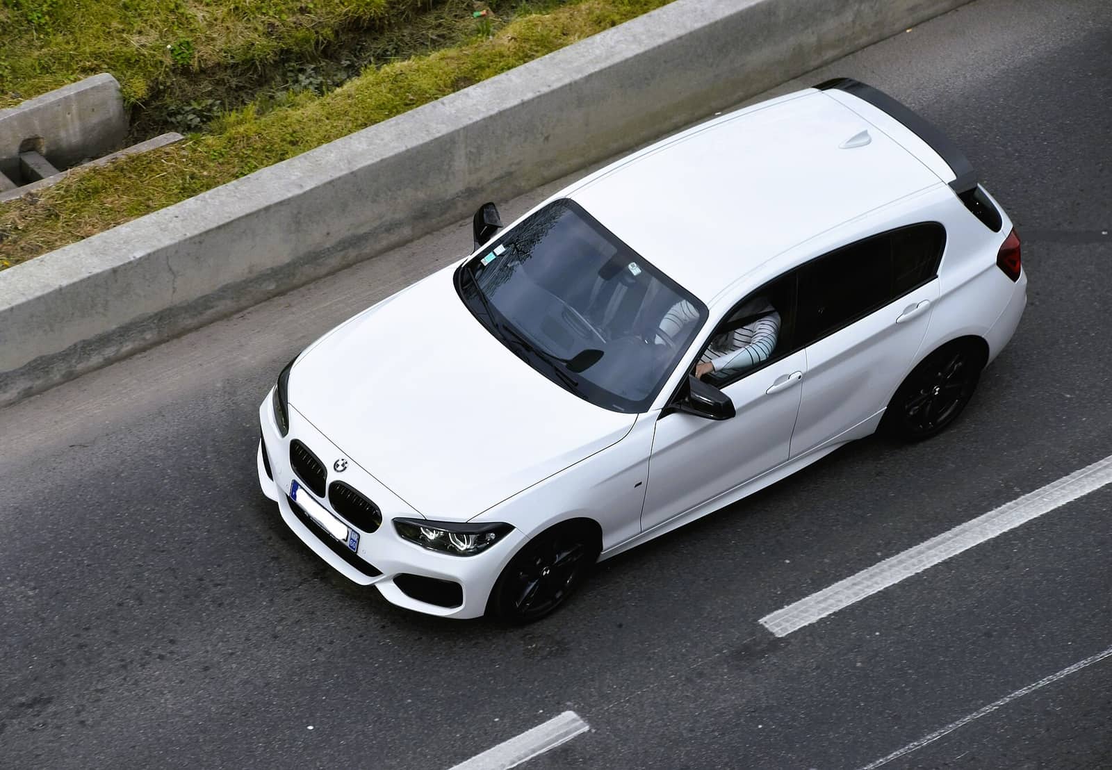 White BMW M140i xDrive seen from above, front