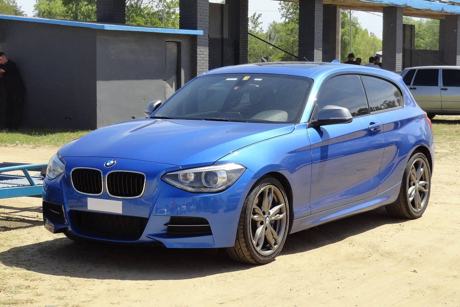 Blue BMW M135i three-door, front three-quarter view