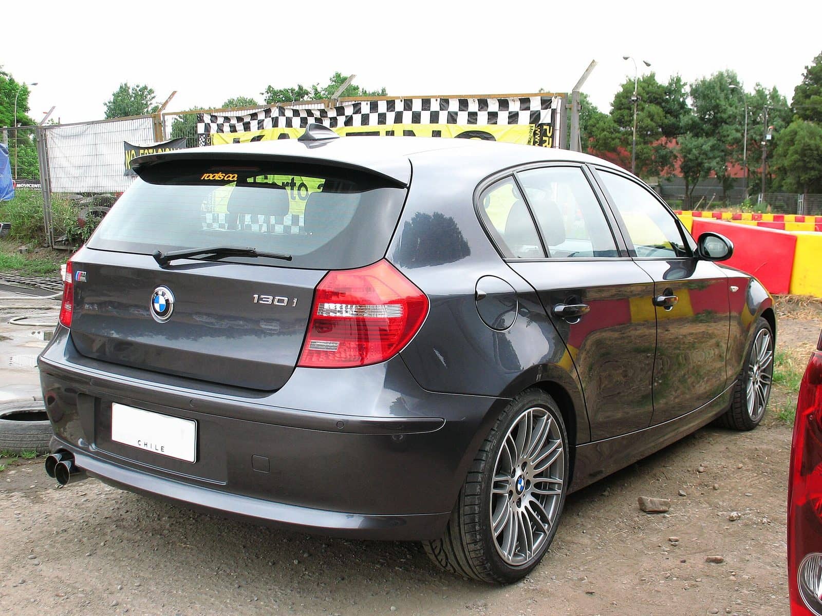 Grey BMW 130i M Sport, rear three-quarter view