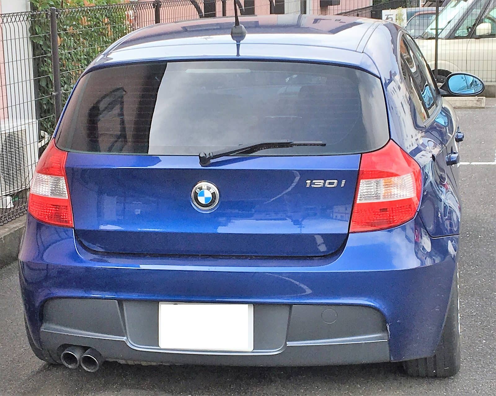 Blue BMW 130i M Sport, rear view