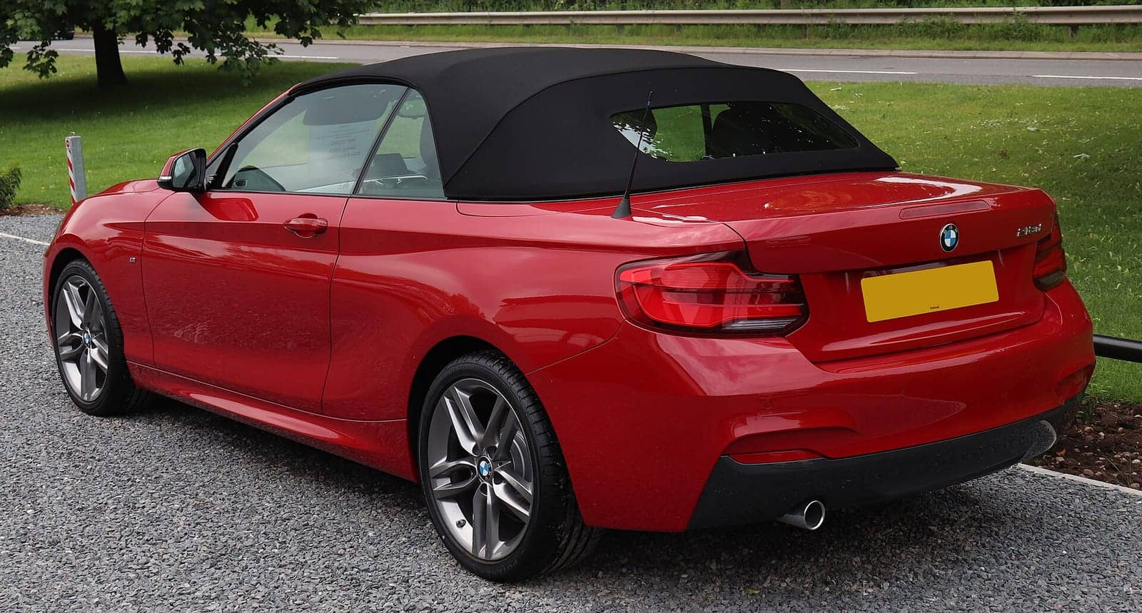 Red BMW 218d M Sport convertible (facelift), rear three-quarter view
