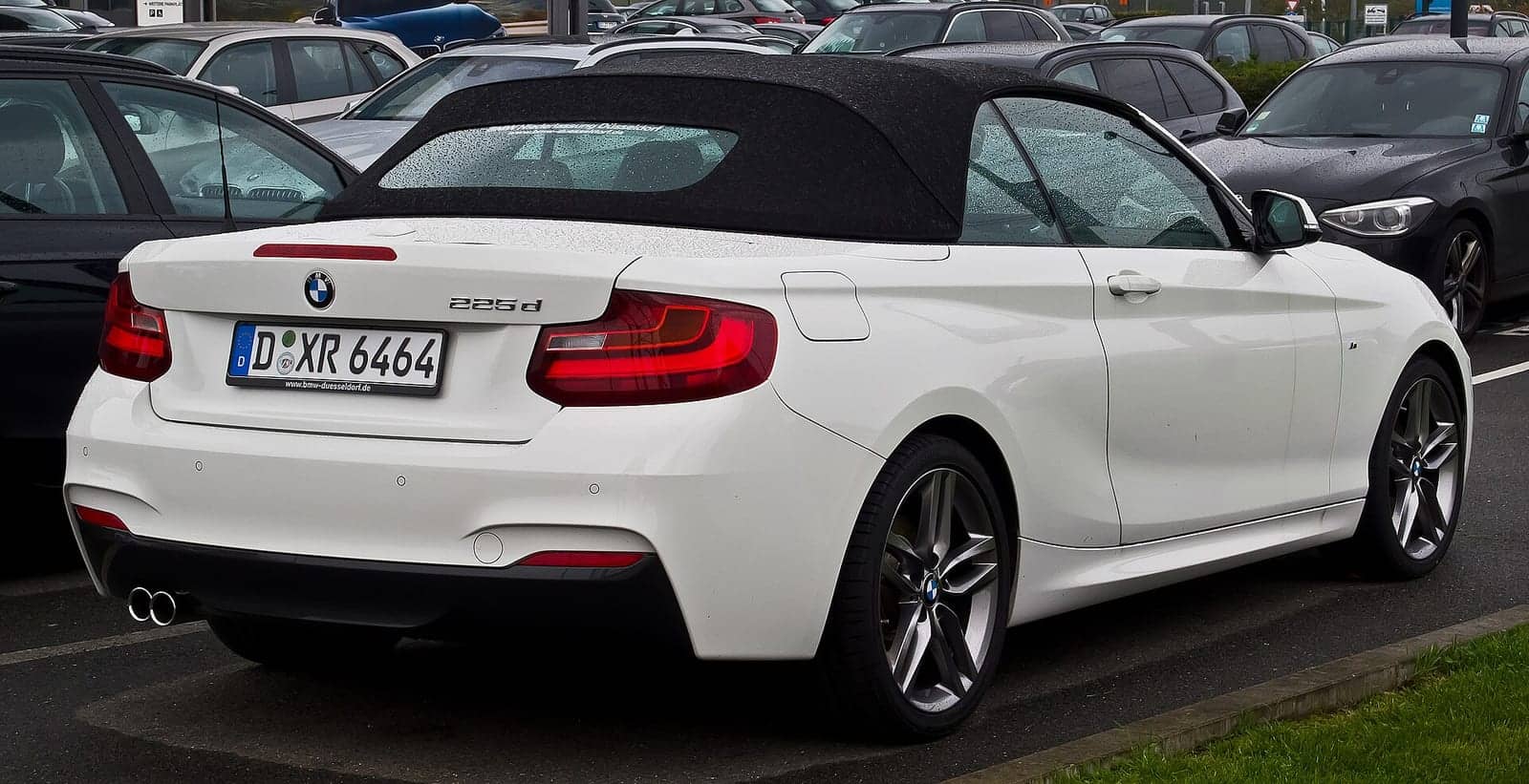 White BMW 225d M Sport convertible, rear three-quarter view