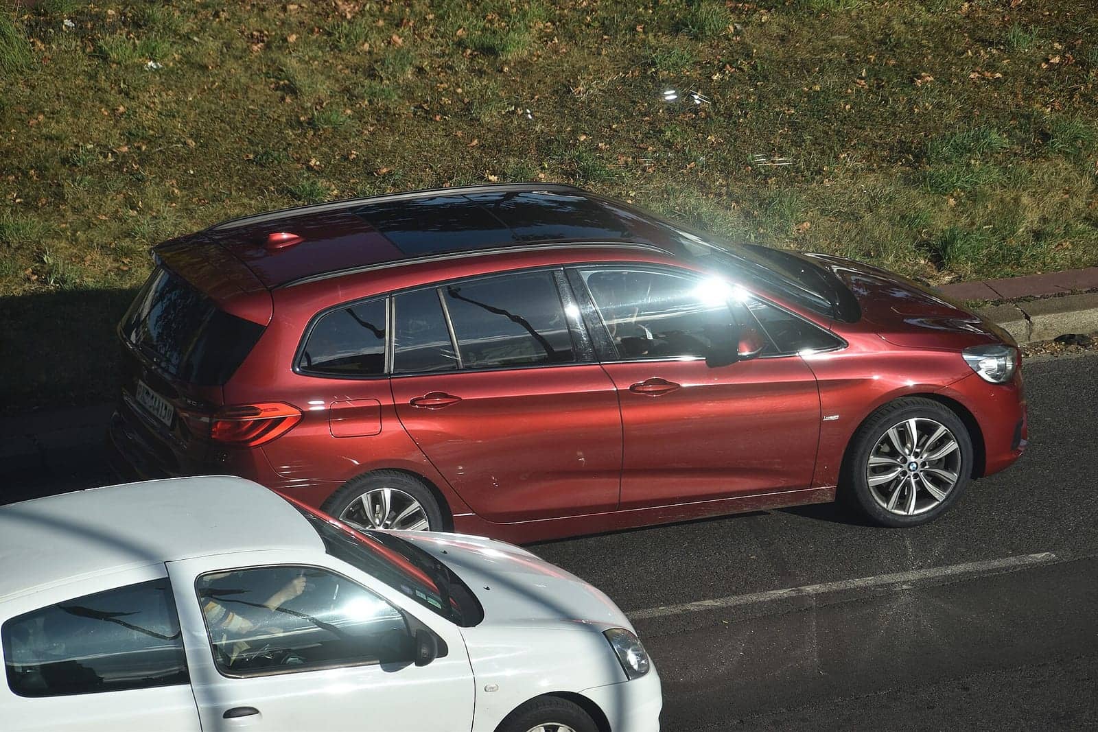 Red BMW 220d Gran Tourer (facelift), side view