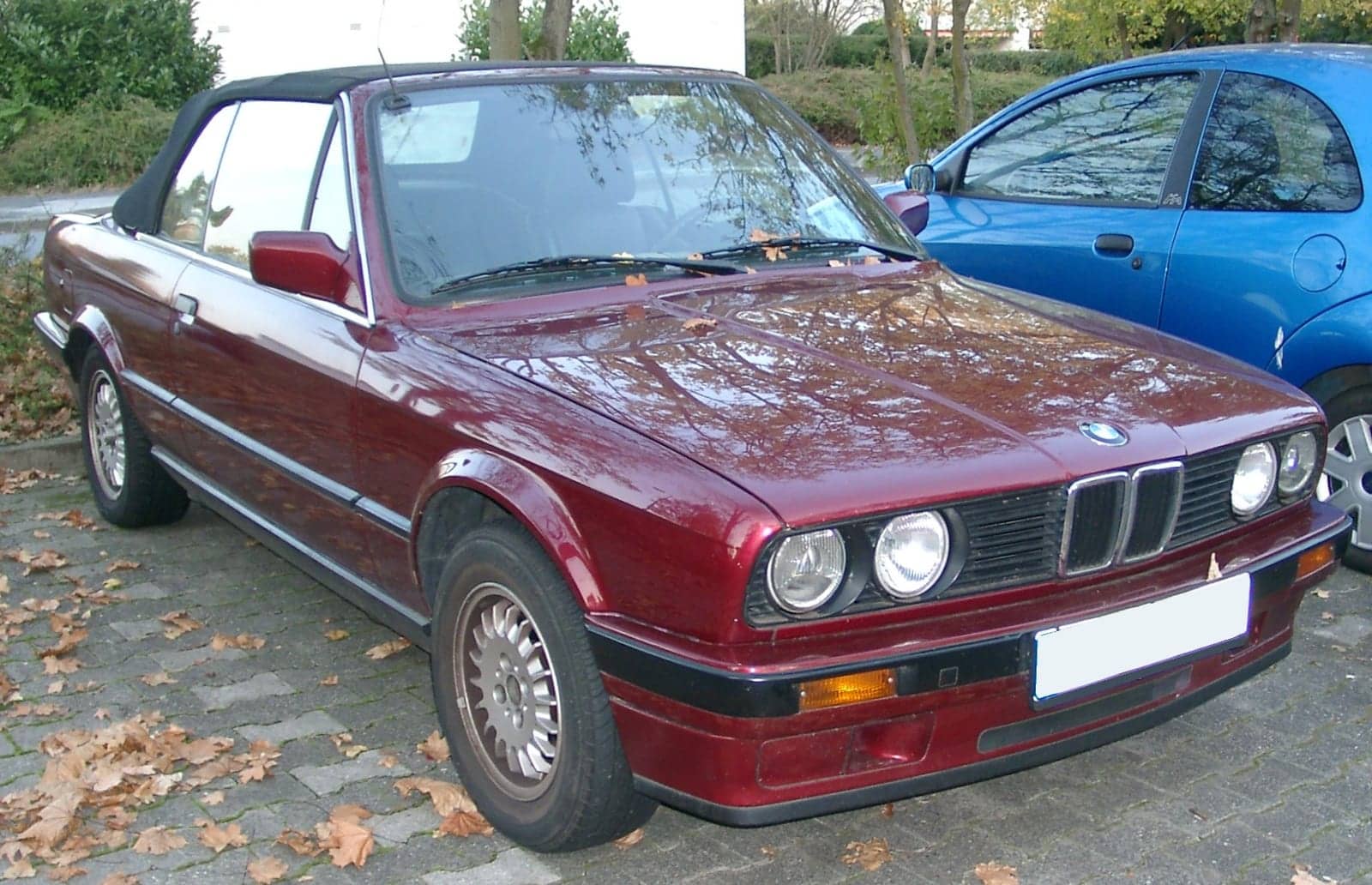 Maroon BMW 3 Series convertible, front three-quarter view