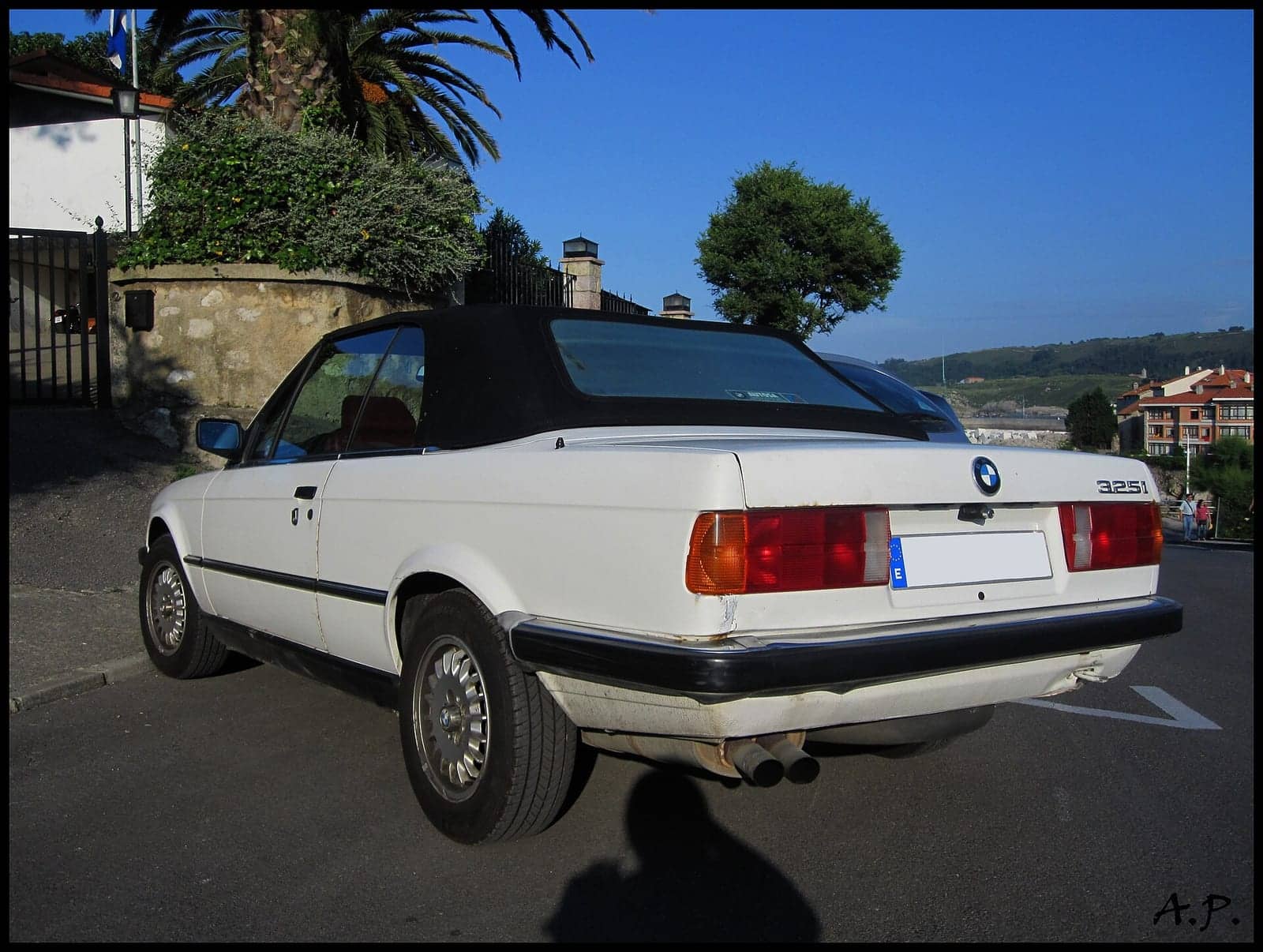 White BMW 325i convertible, rear three-quarter view