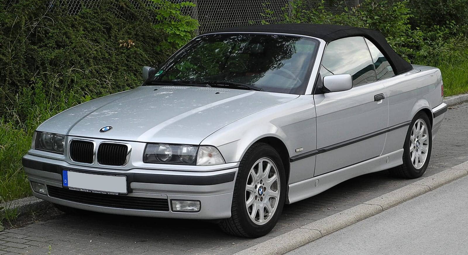 Silver BMW 320i convertible, front three-quarter view
