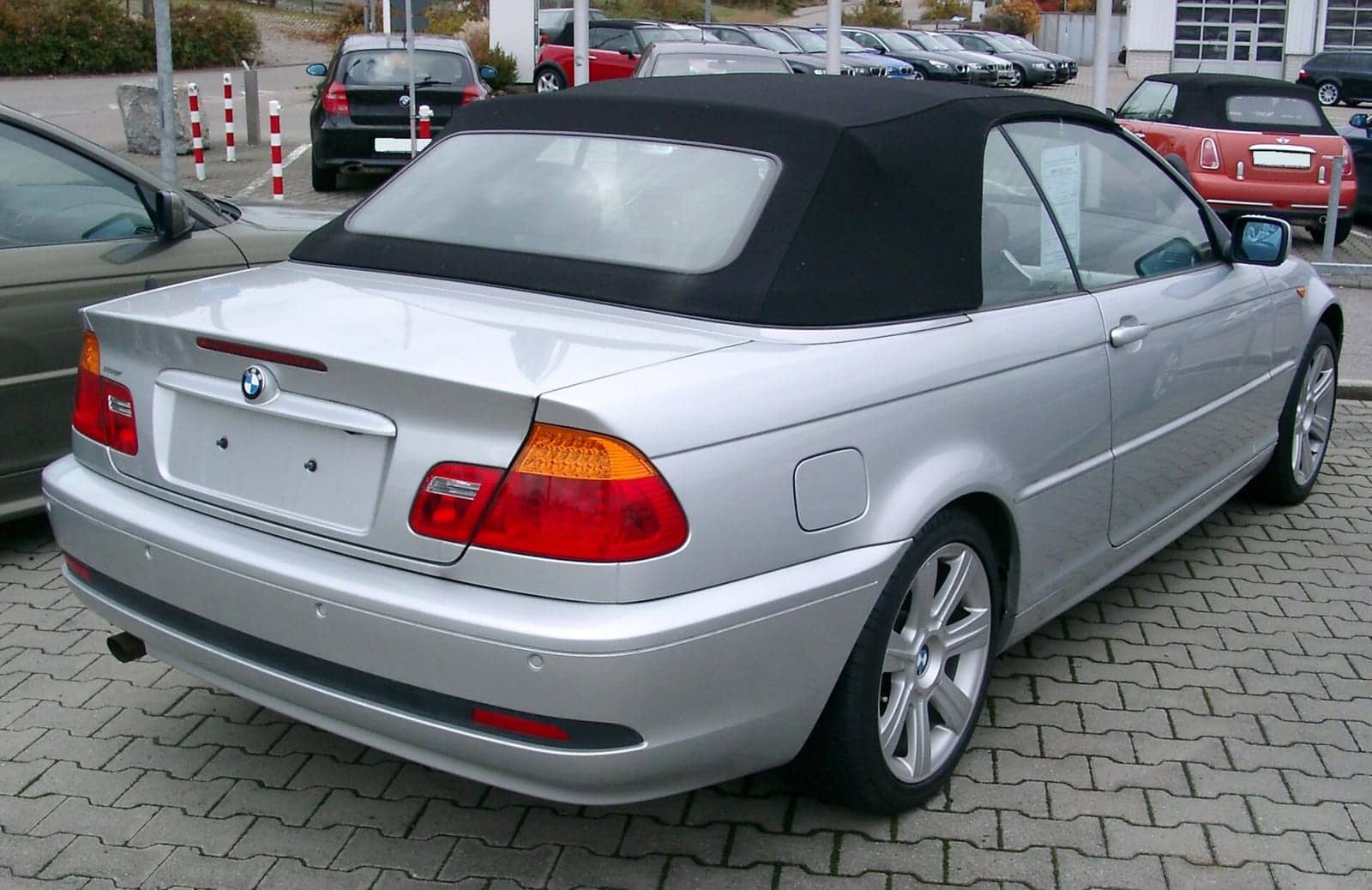 Silver BMW 3 Series convertible, rear three-quarter view