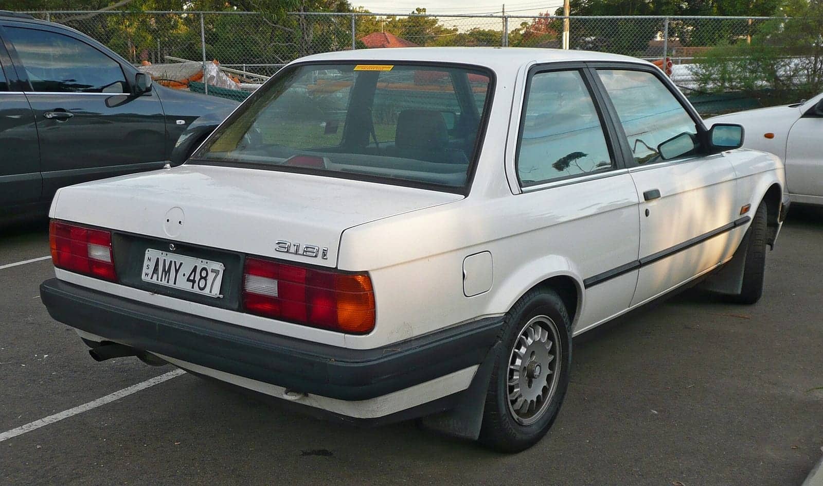 White BMW 318i two-door (facelift), rear three-quarter view