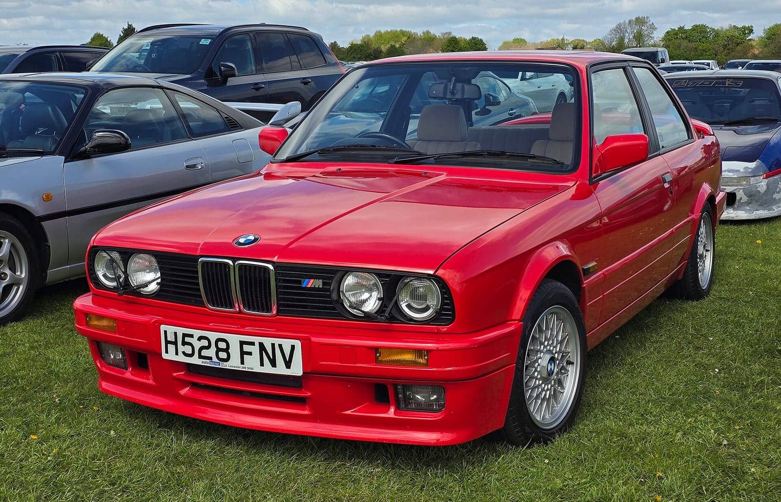 Red BMW 325i Sport two-door (facelift), front three-quarter view