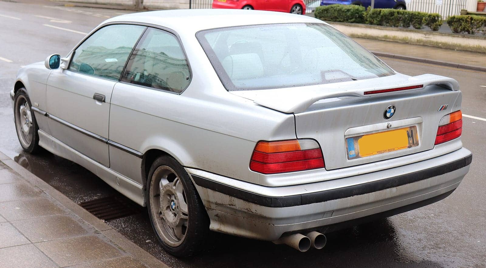 Silver BMW 323i coupé, rear three-quarter view