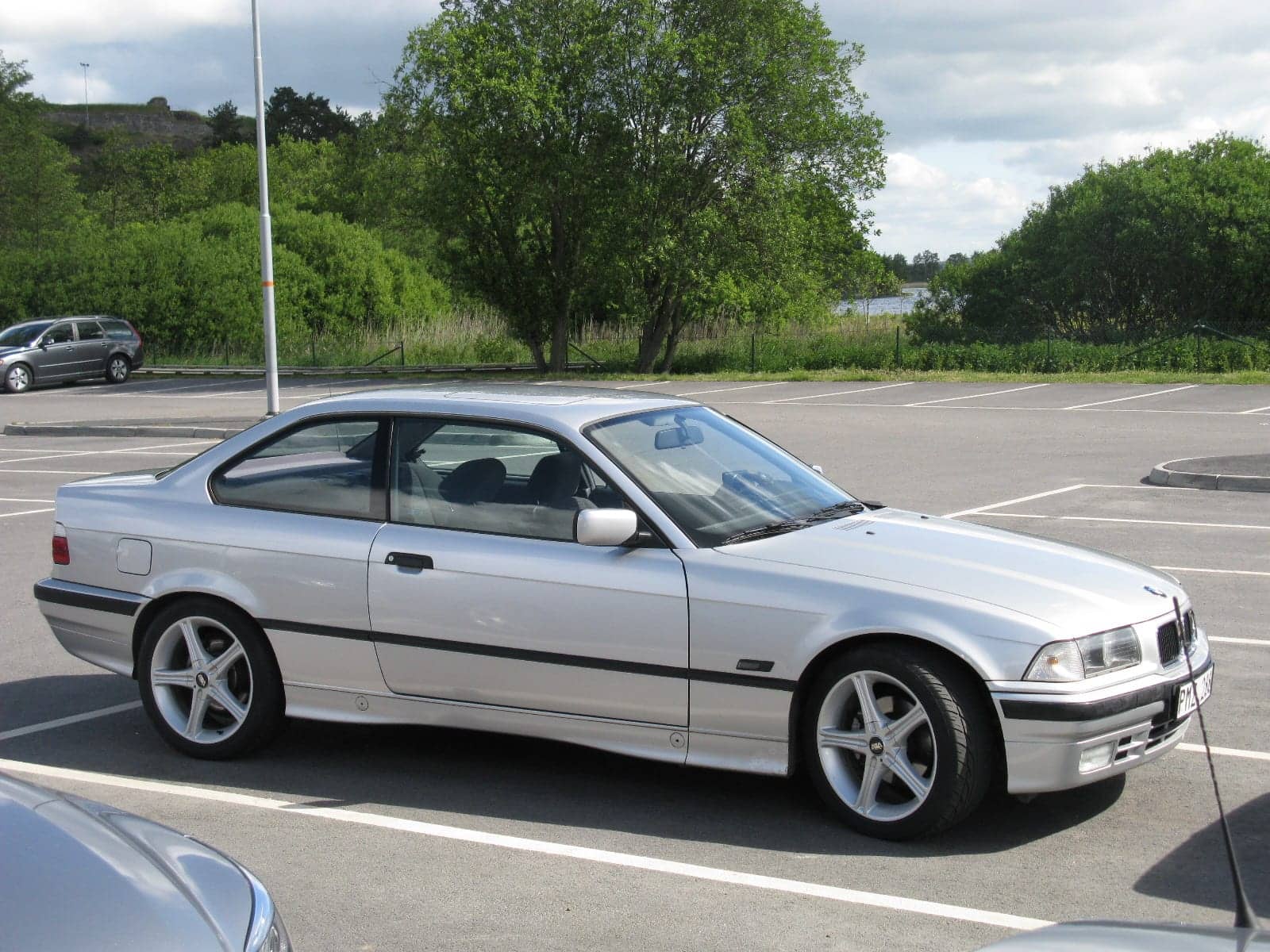 Silver BMW 325i coupé, side view