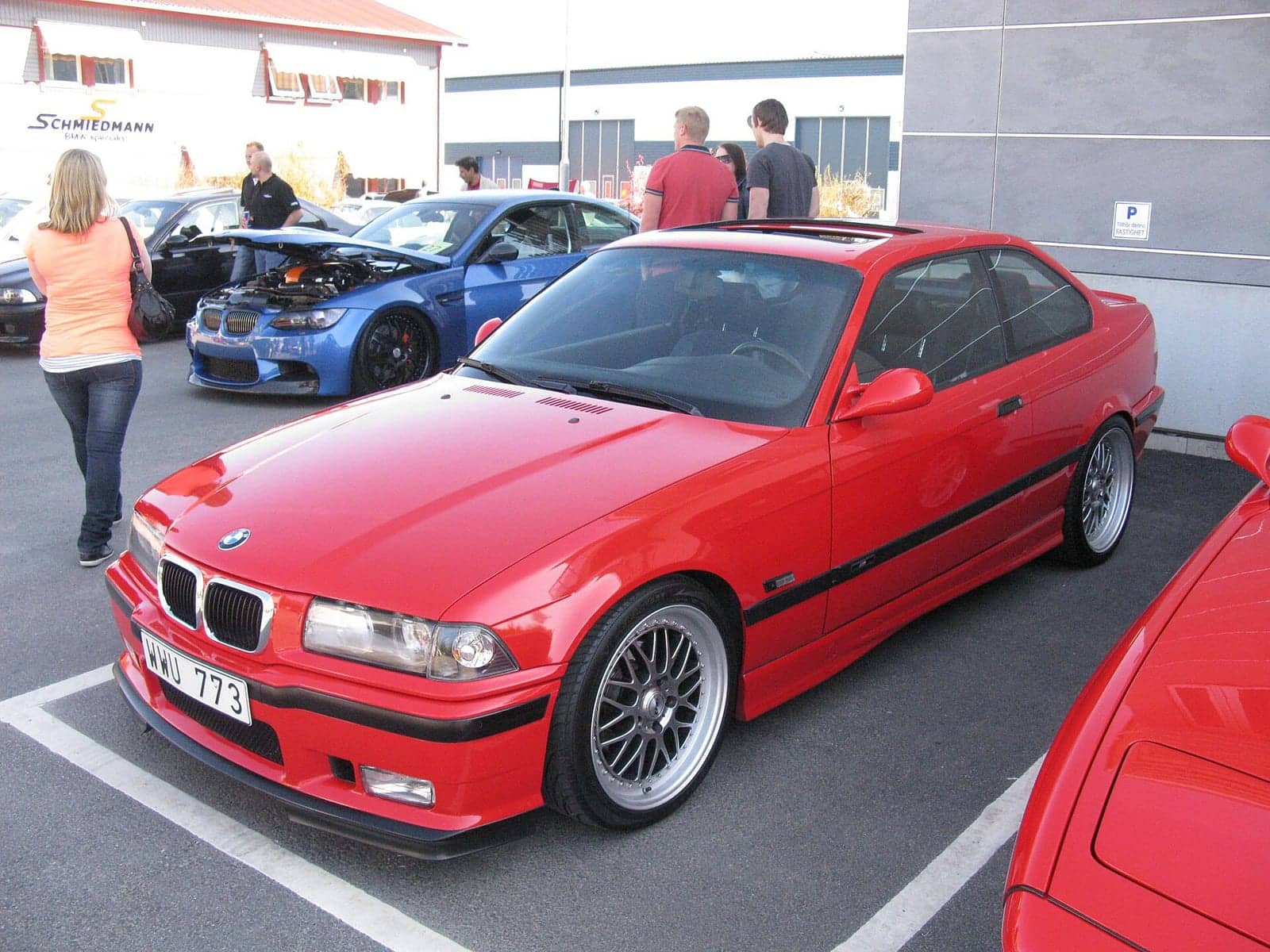 Red BMW 328i M Sport coupé, front three-quarter view
