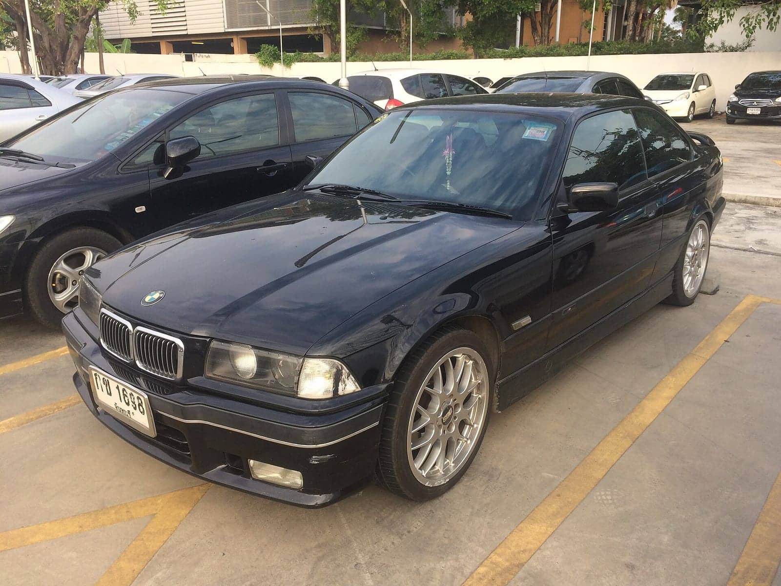 Black BMW 328is coupé, front three-quarter view