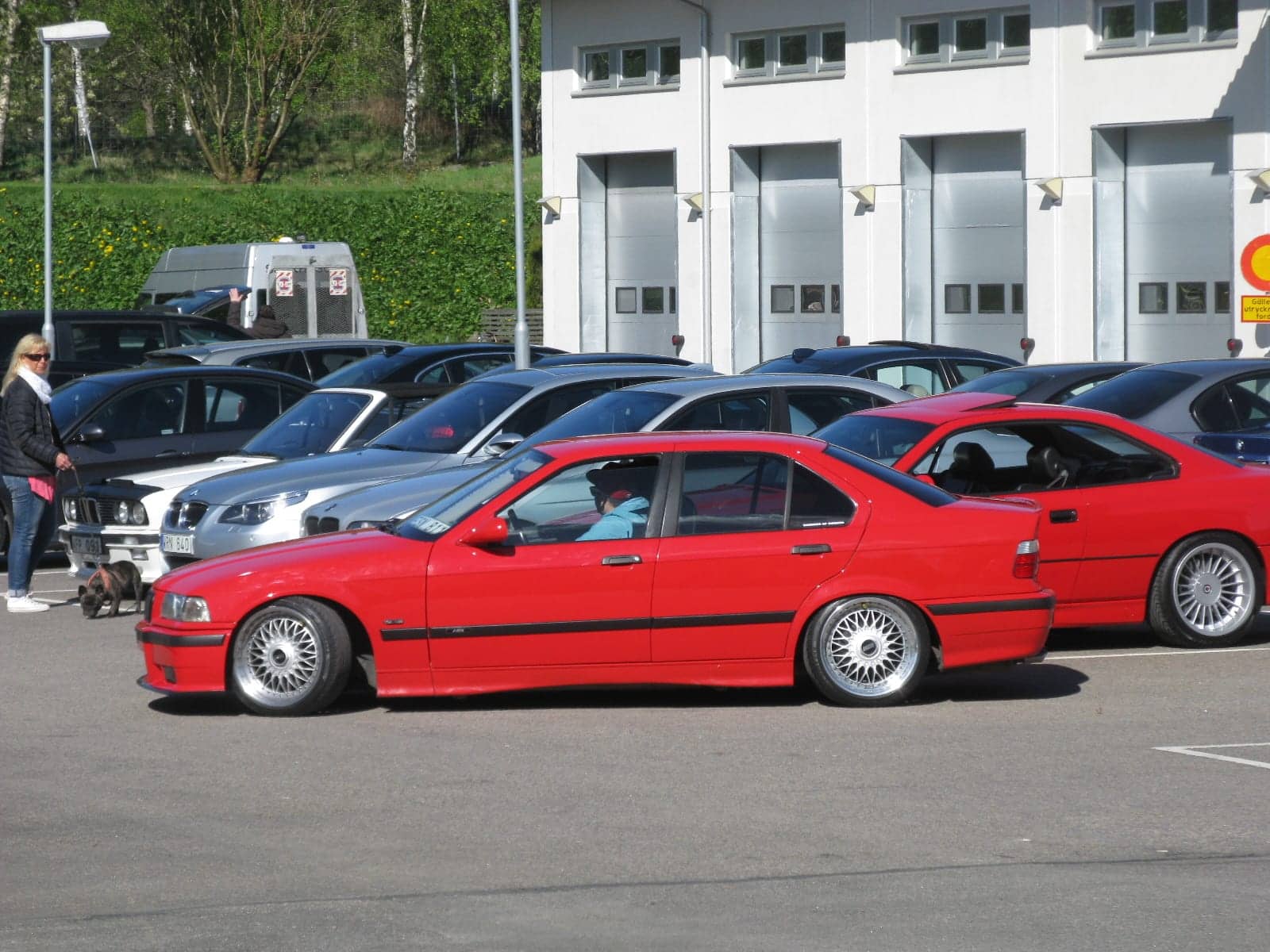 Red BMW 328i sedan, side view
