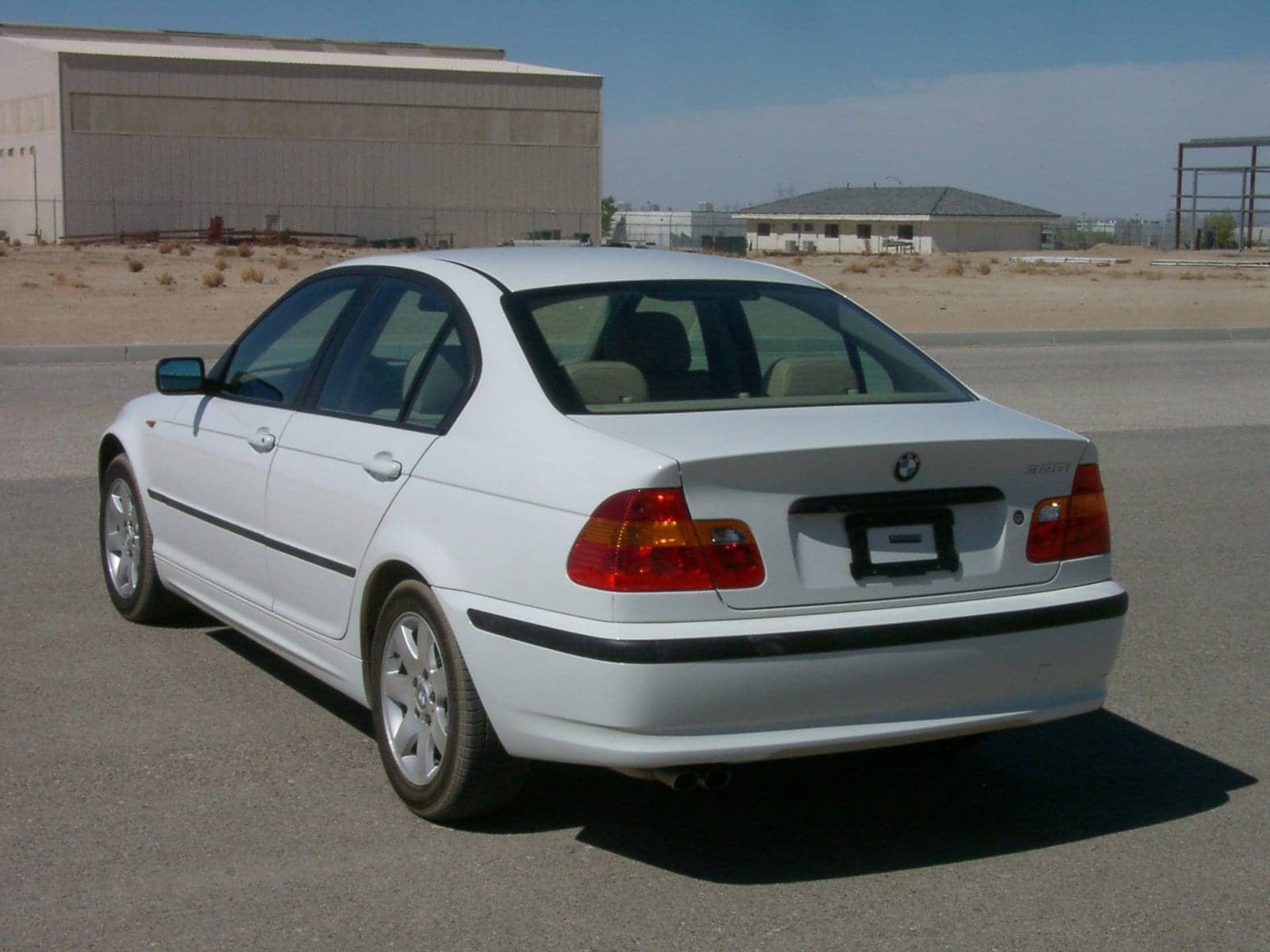White BMW 325i sedan (facelift), rear three-quarter view