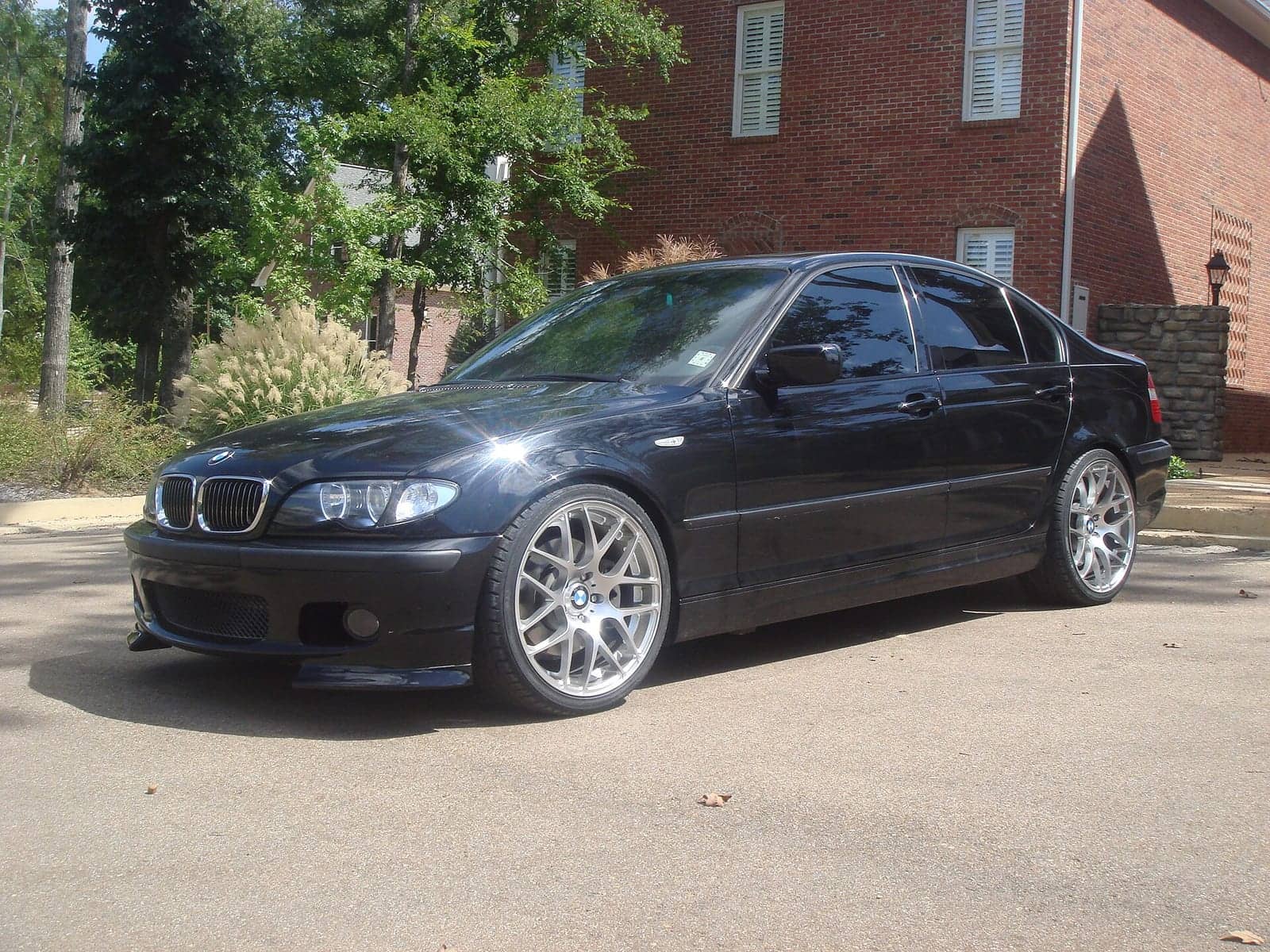 Black BMW 330i ZHP sedan (facelift), front three-quarter view