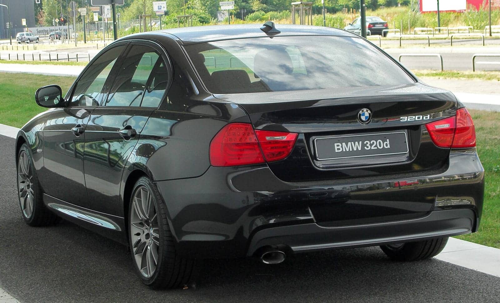 Black BMW 320d Edition Sport sedan (facelift), rear three-quarter view