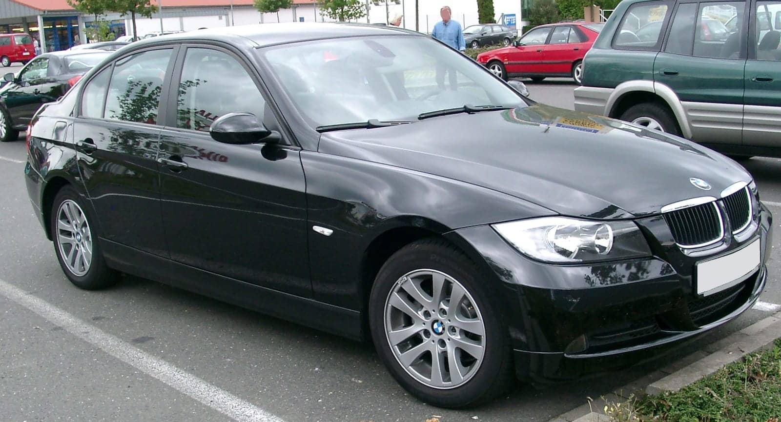Black BMW 3 Series sedan, front three-quarter view