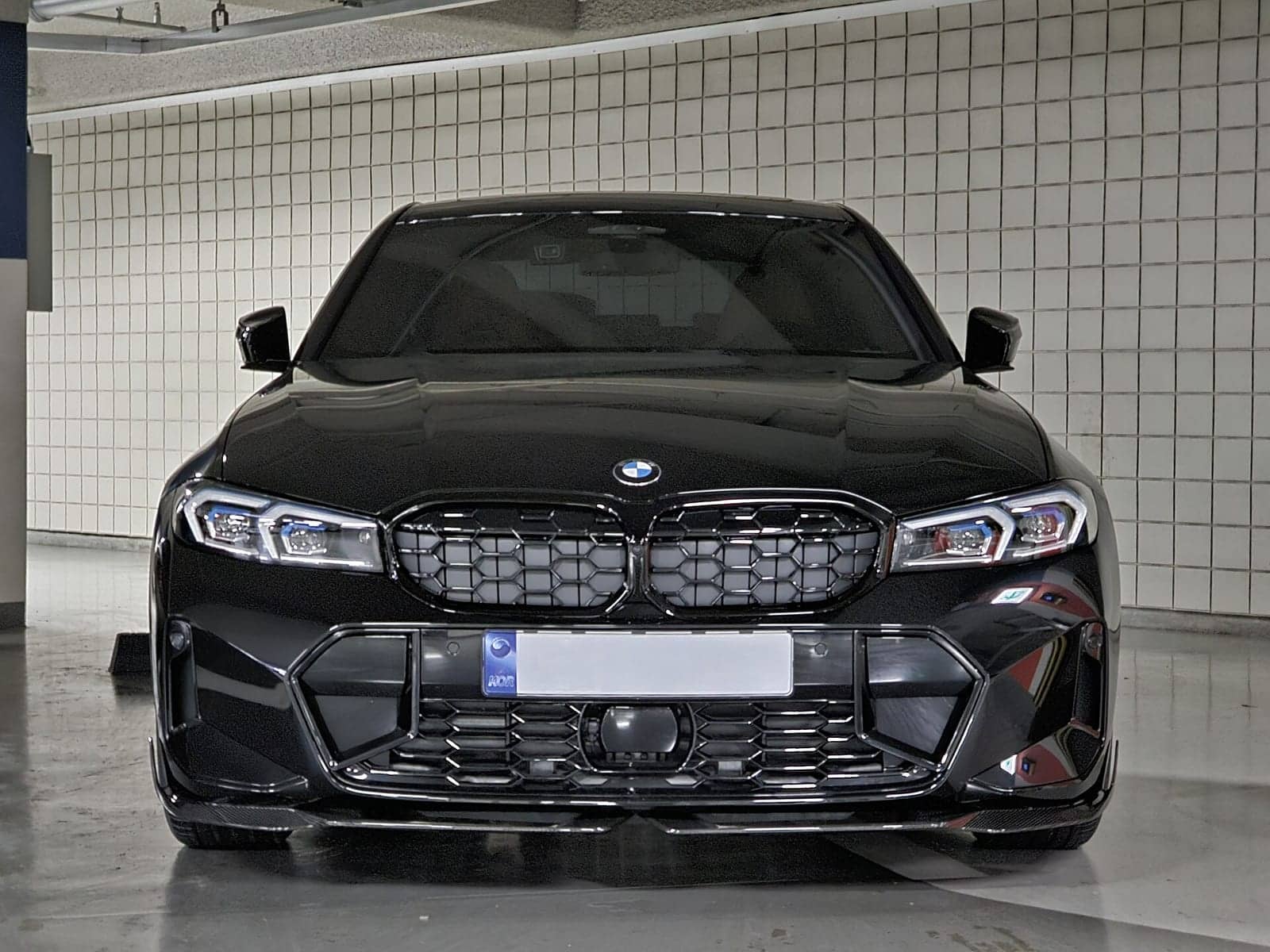 Black BMW M340i sedan, front view