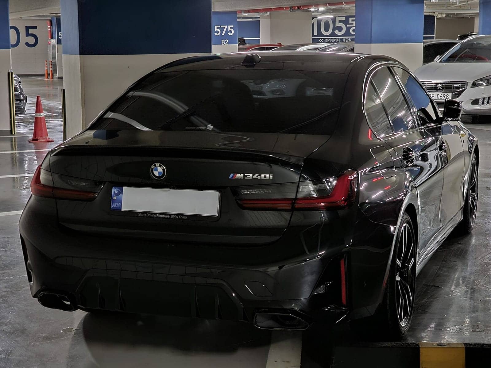 Black BMW M340i sedan, rear view