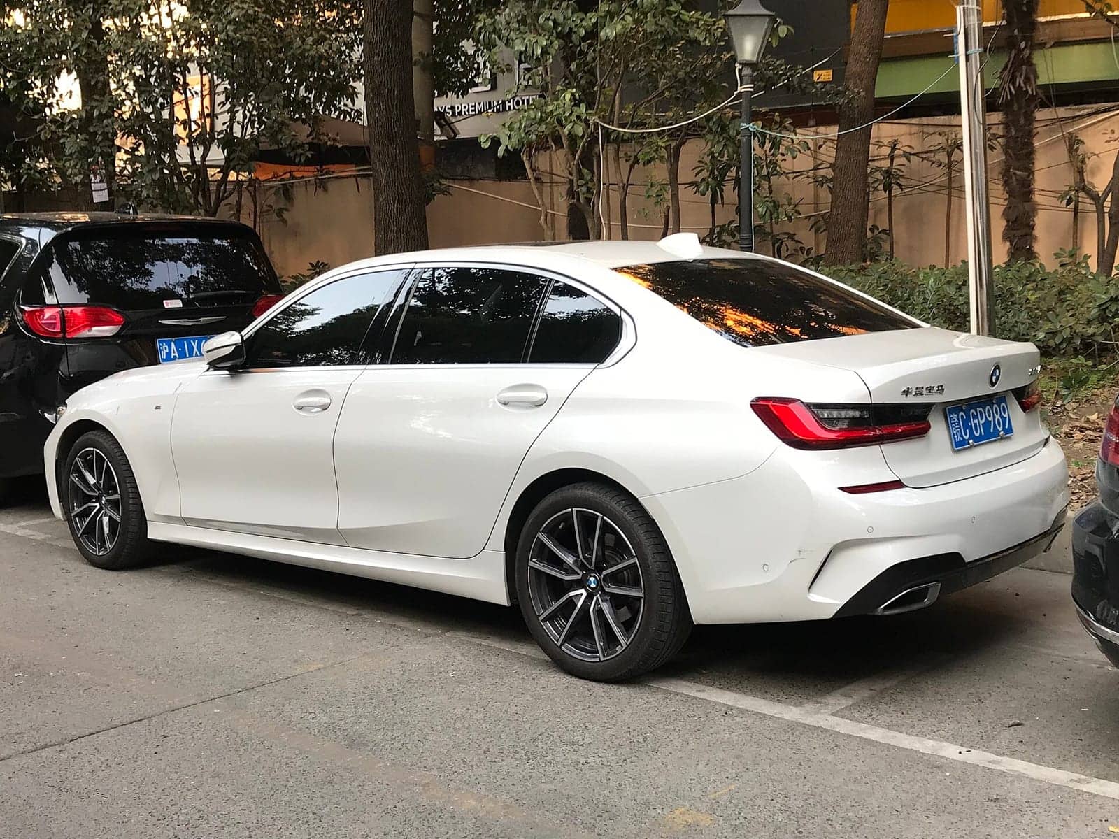 White BMW 325Li, rear three-quarter view
