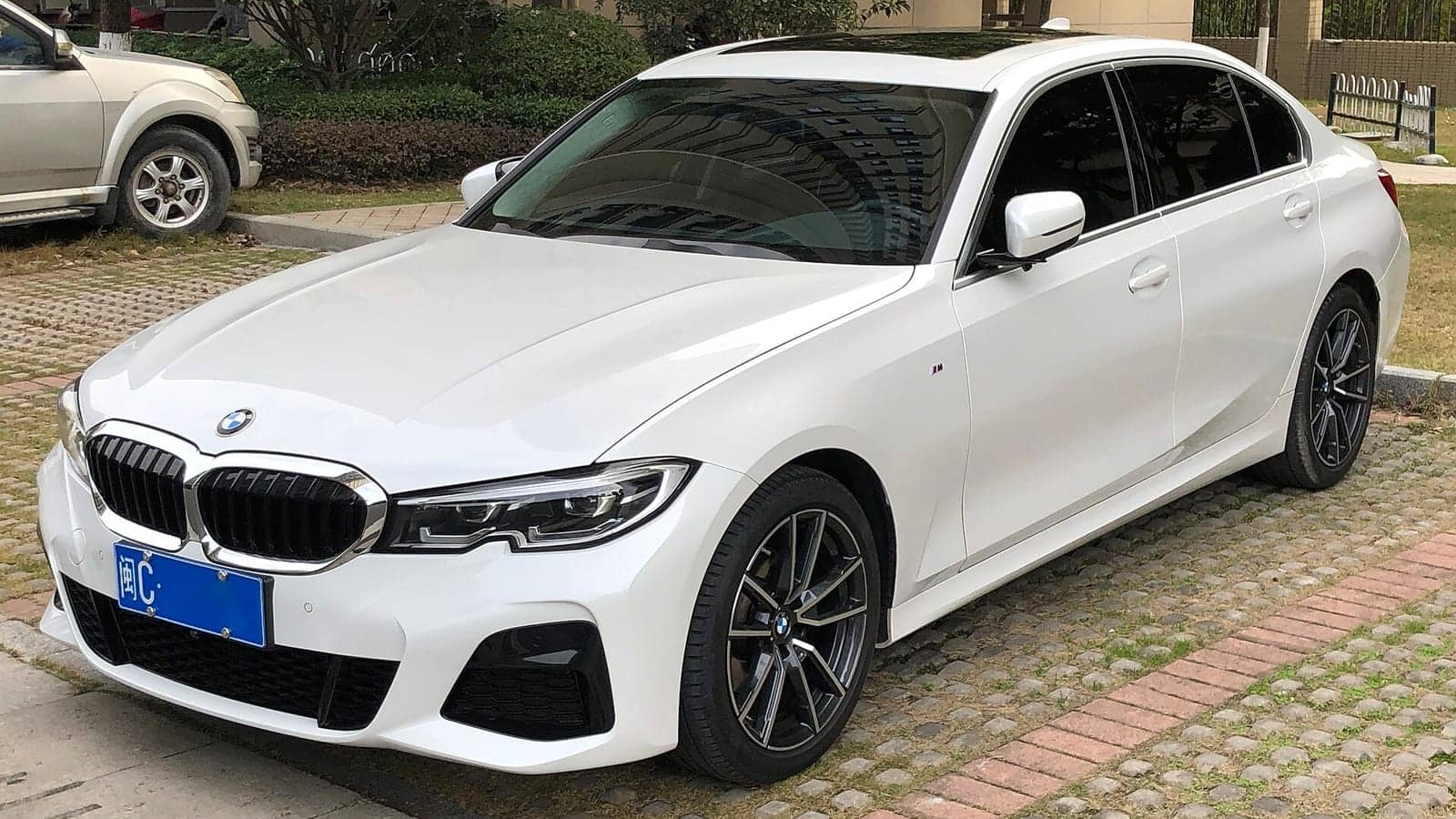 White BMW 3 Series Li, front three-quarter view