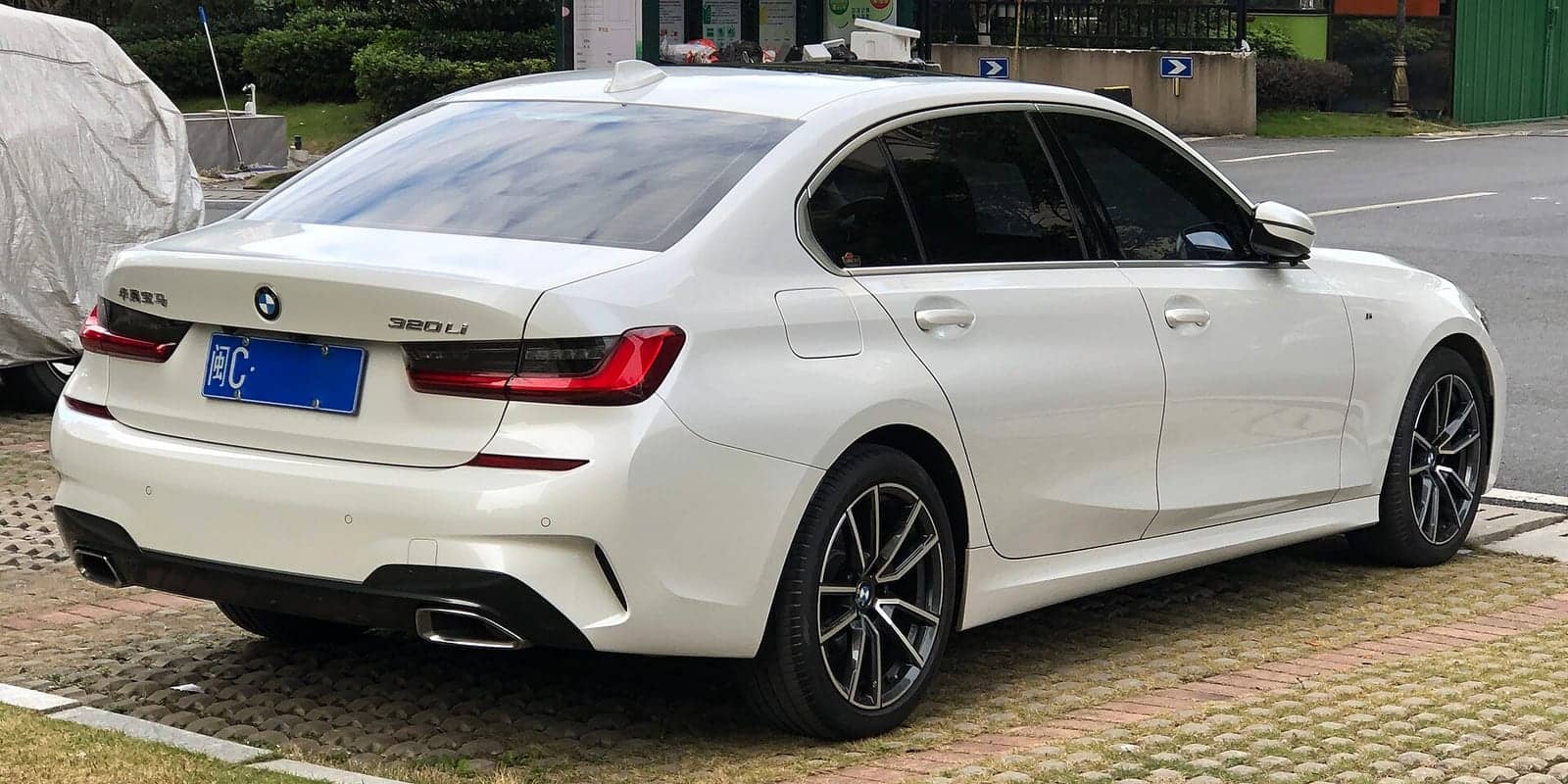 White BMW 3 Series Li, rear three-quarter view