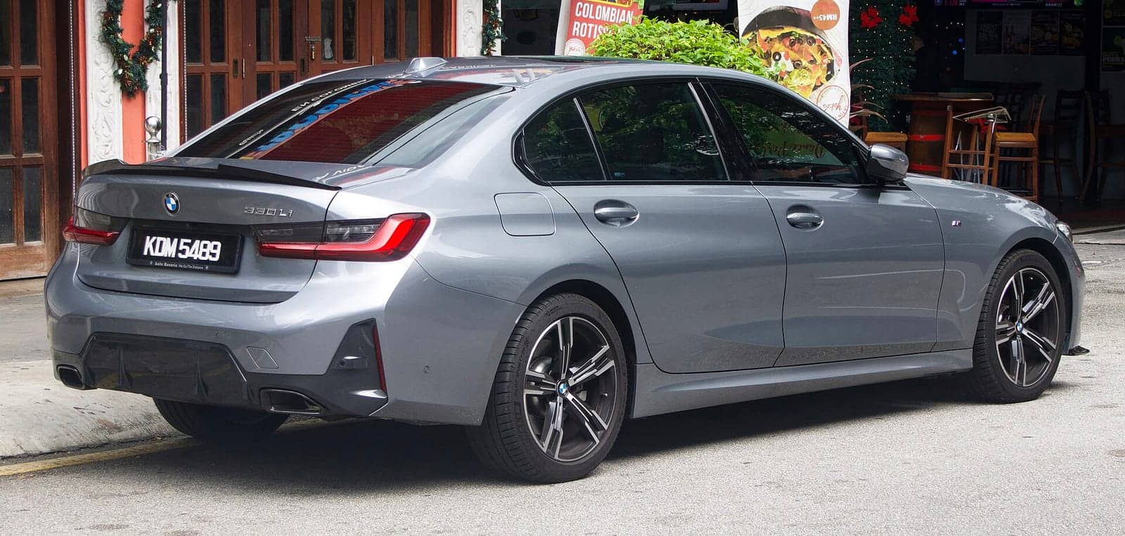 Grey BMW 330Li M Sport (facelift), rear three-quarter view