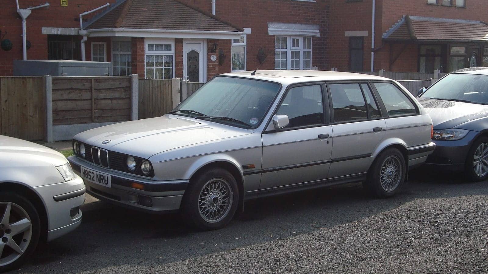 Silver BMW 325i Touring, side view