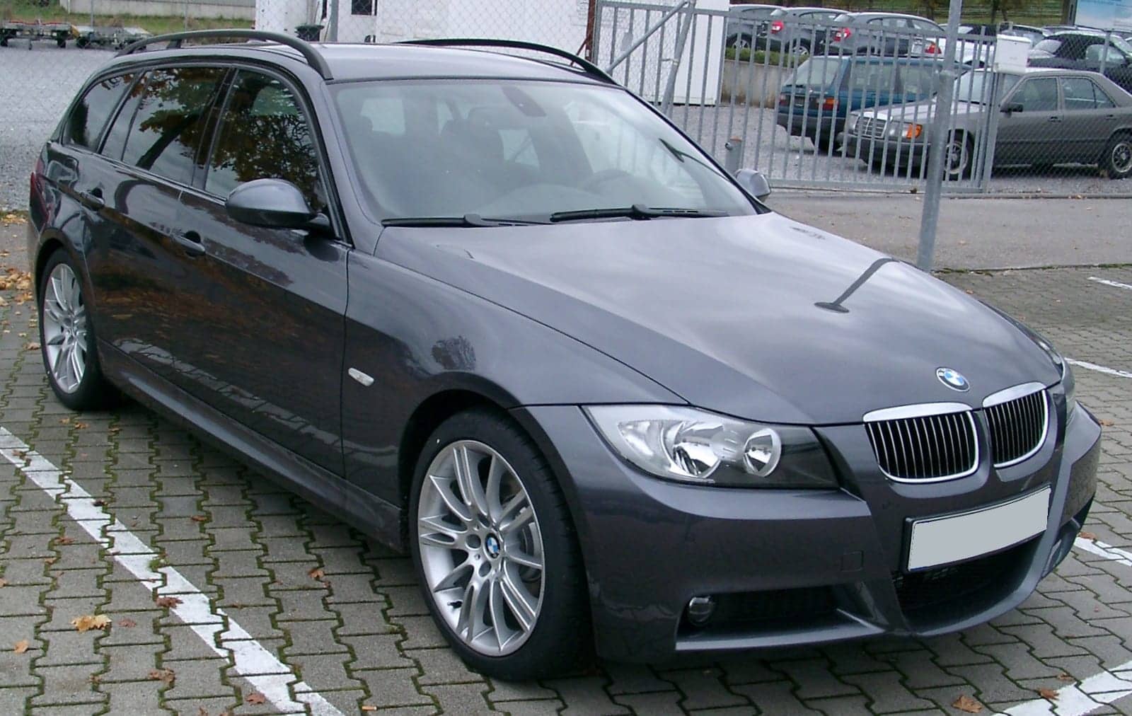 Grey BMW 3 Series Touring, front three-quarter view