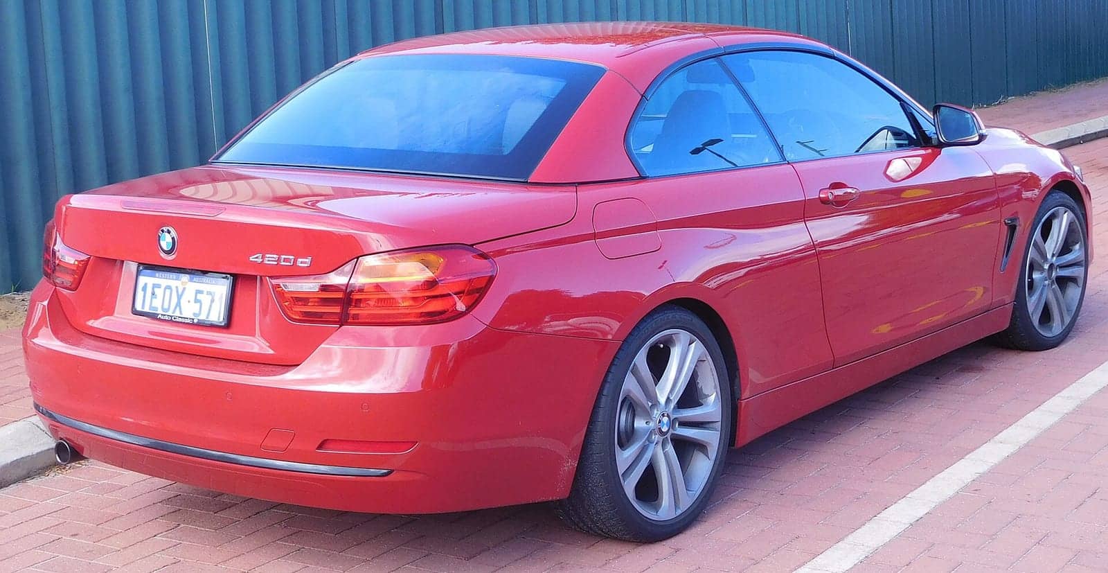 Red BMW 420d convertible, rear three-quarter view