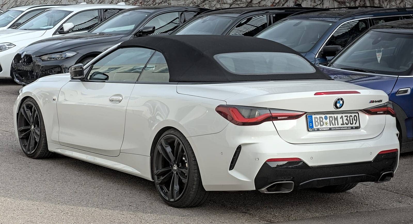 White BMW M440i convertible (facelift), rear three-quarter view