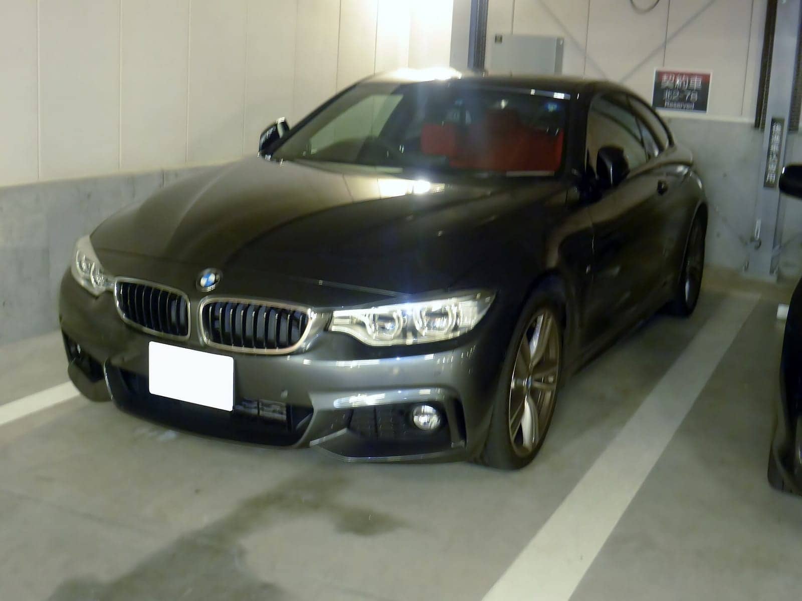 Black BMW 435i Sport coupé, front three-quarter view