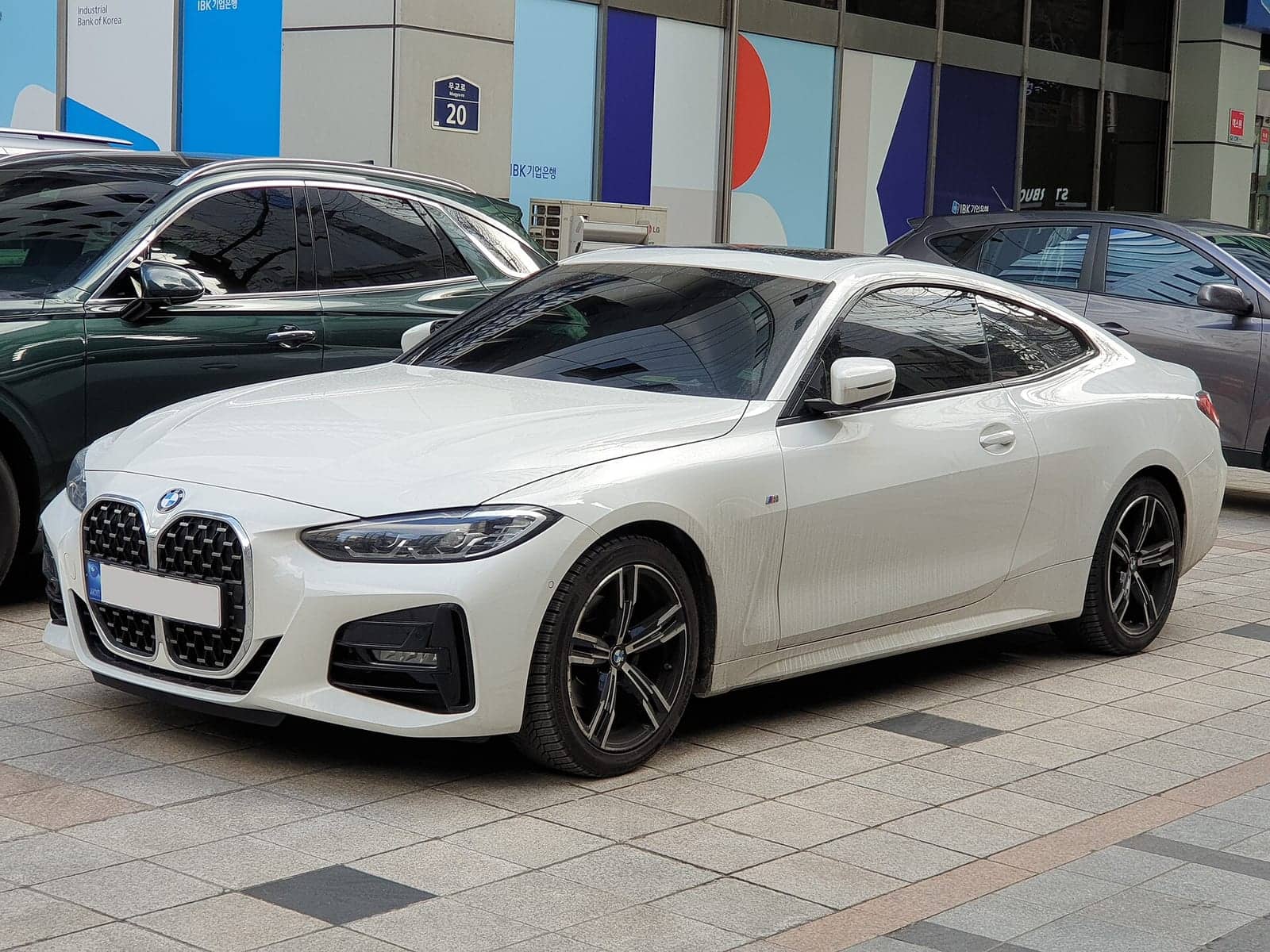 White BMW 430i M Sport coupé, front three-quarter view