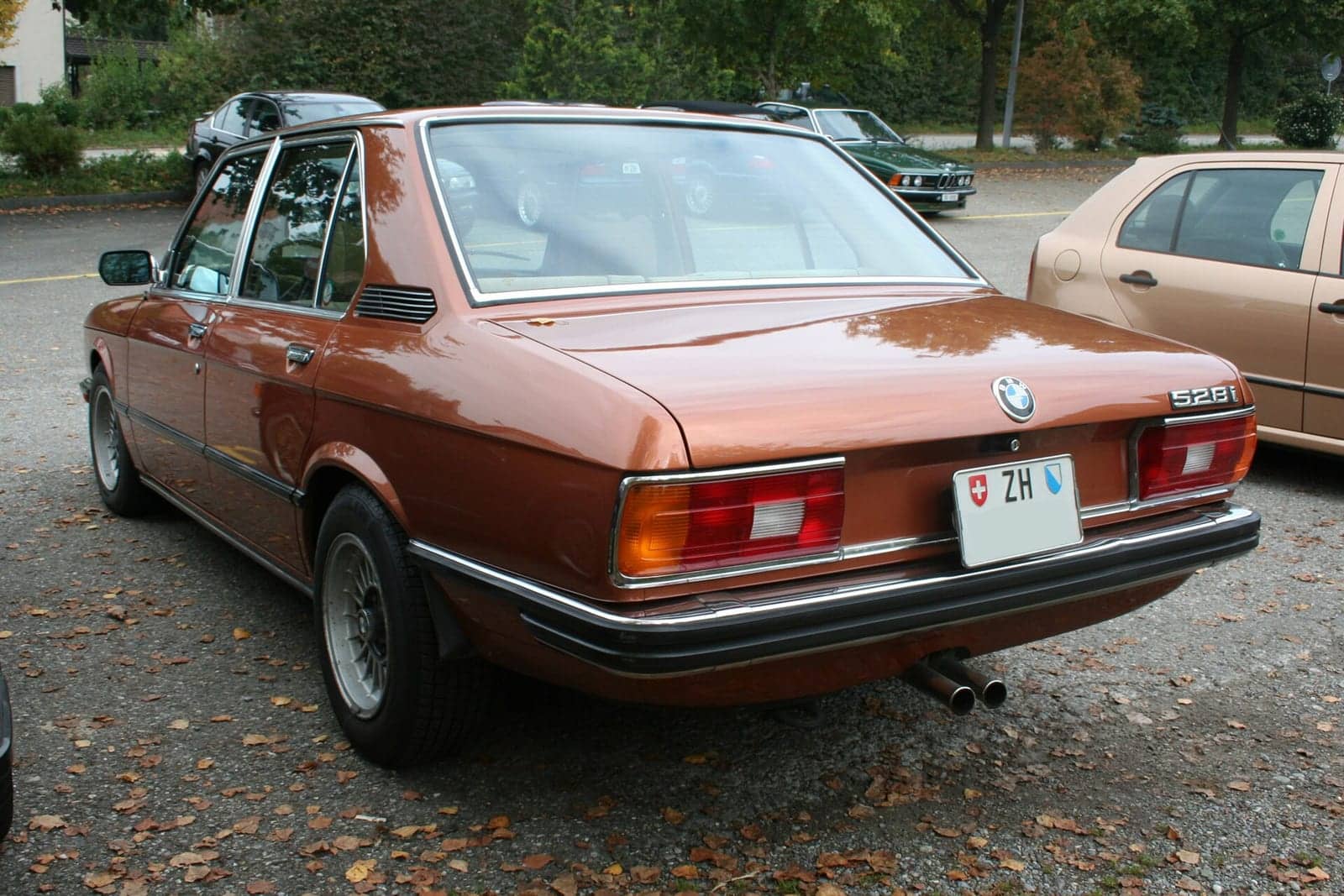 Brown BMW 5 Series (E12), rear three-quarter view