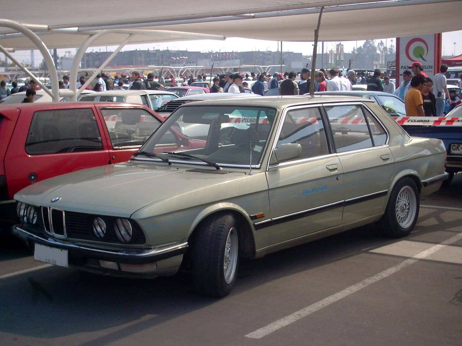 Green BMW 525i, front three-quarter view