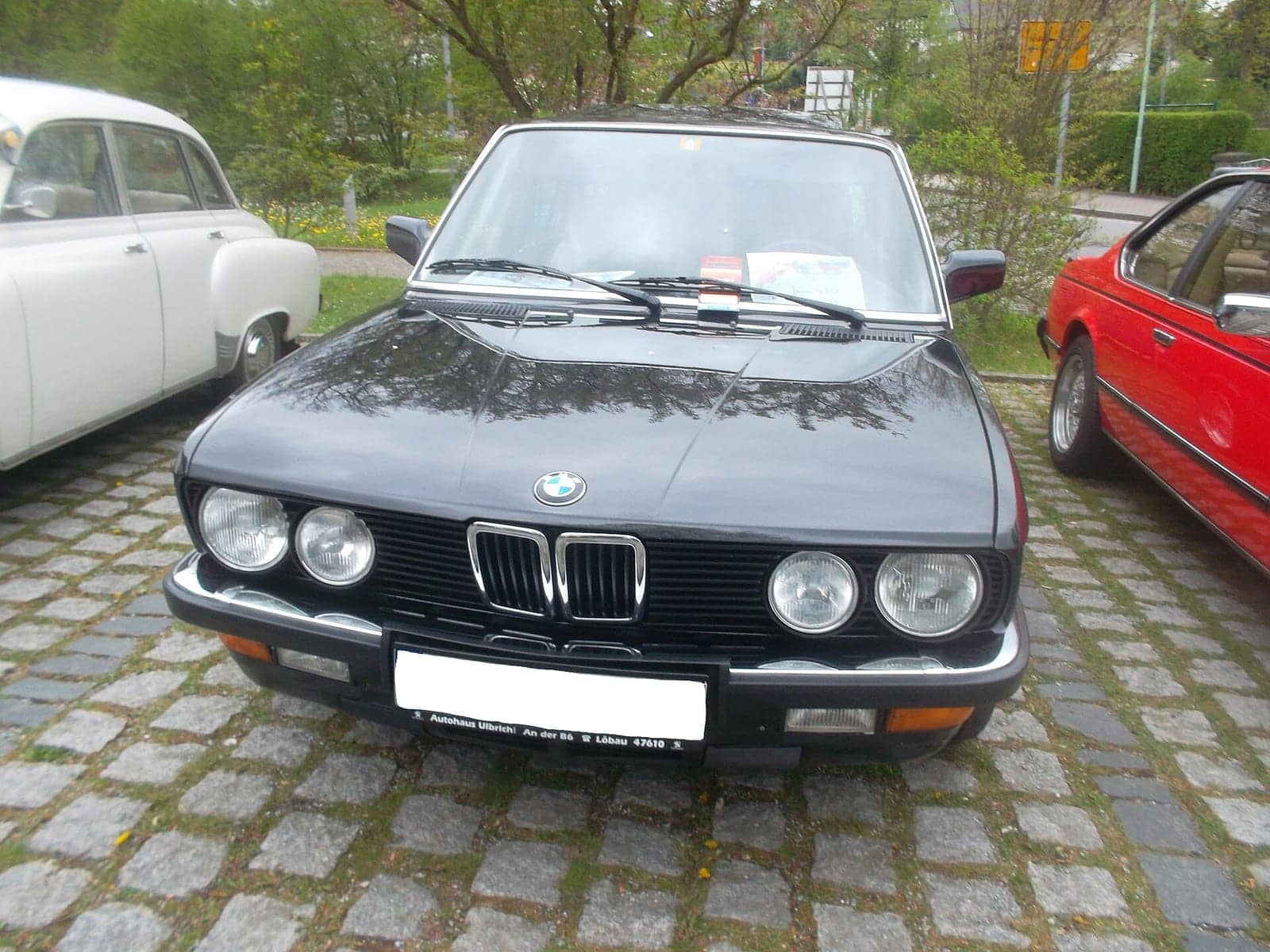 Black BMW 535i, front view