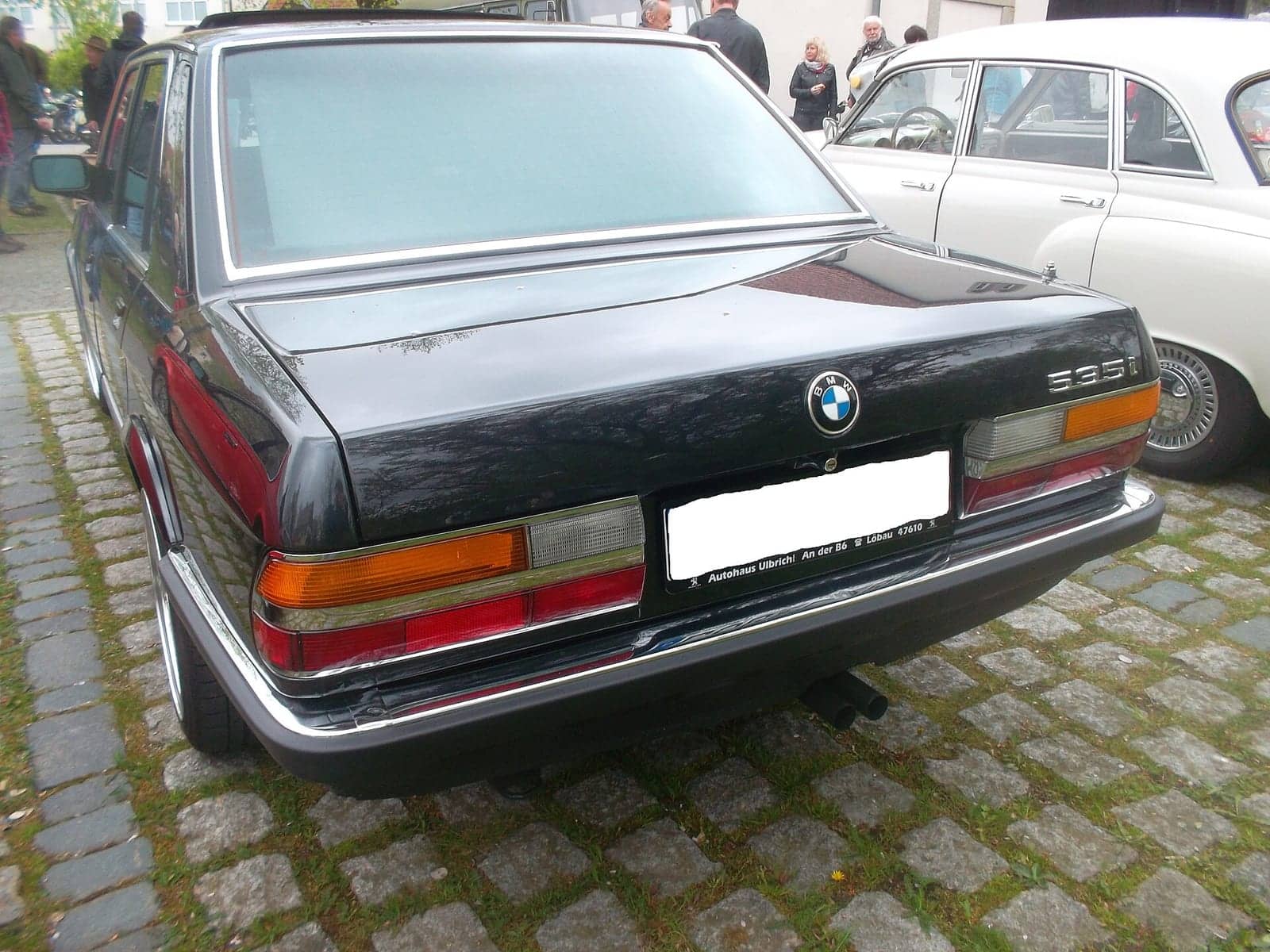 Black BMW 535i, rear view