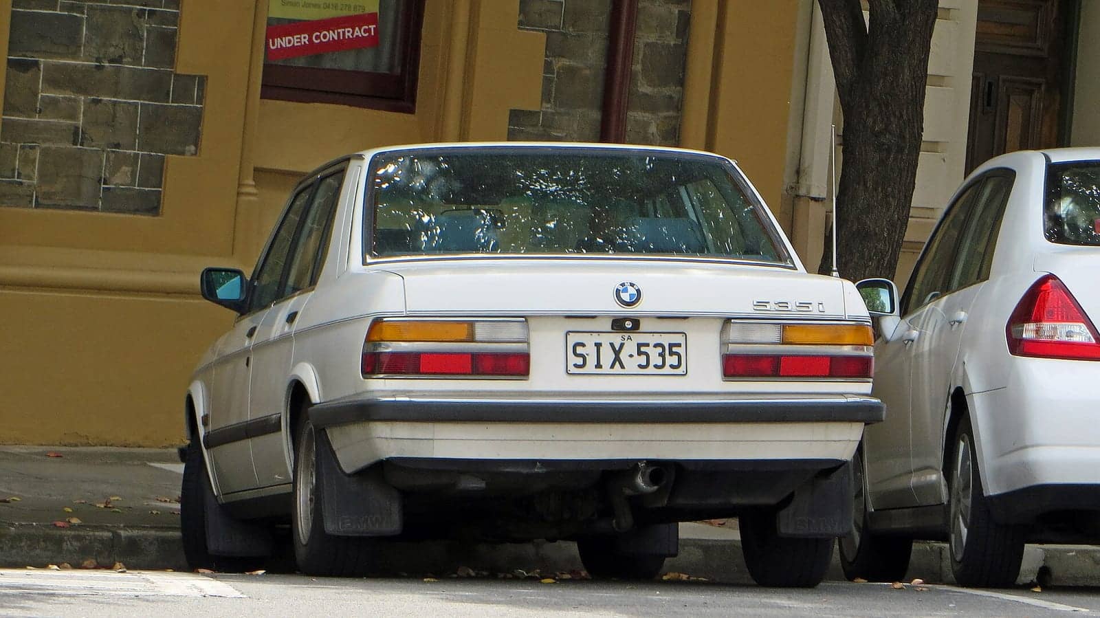White BMW 535i, rear view