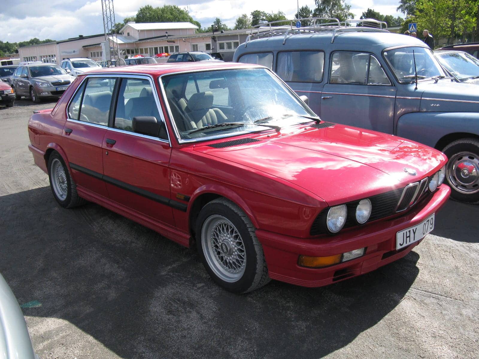Red BMW M535i, front three-quarter view