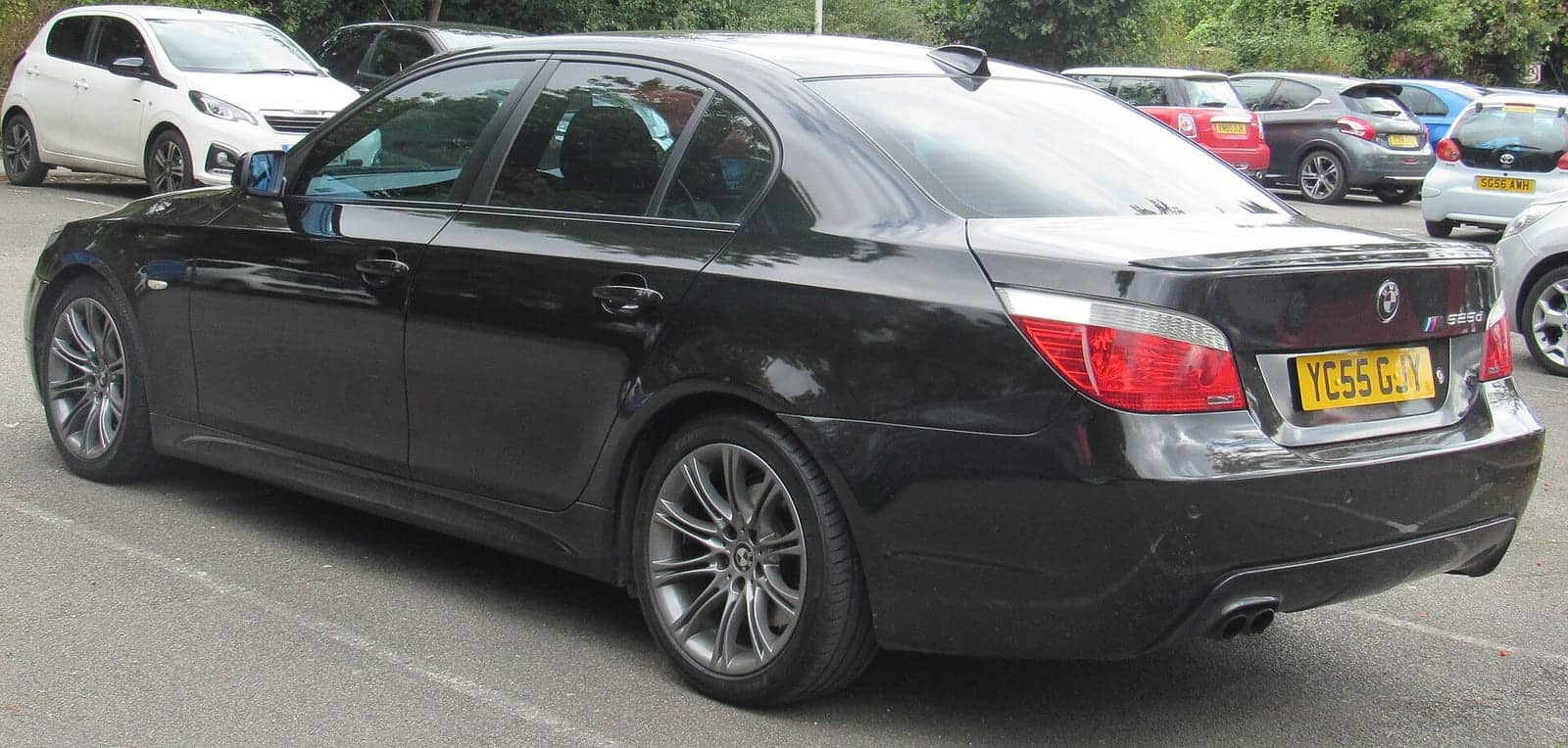 Black BMW 525d M Sport, rear three-quarter view