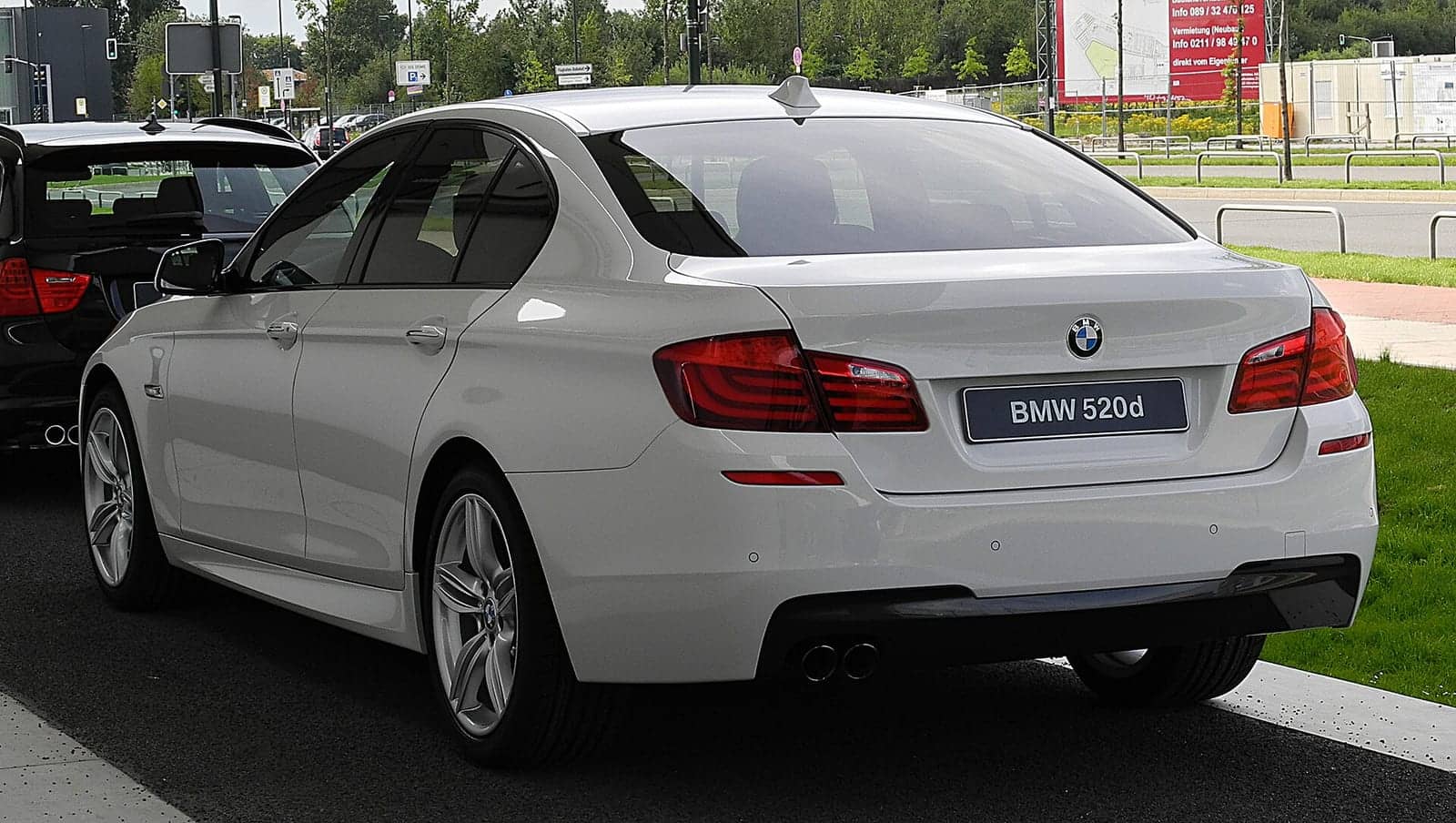 White BMW 520d M Sport, rear three-quarter view
