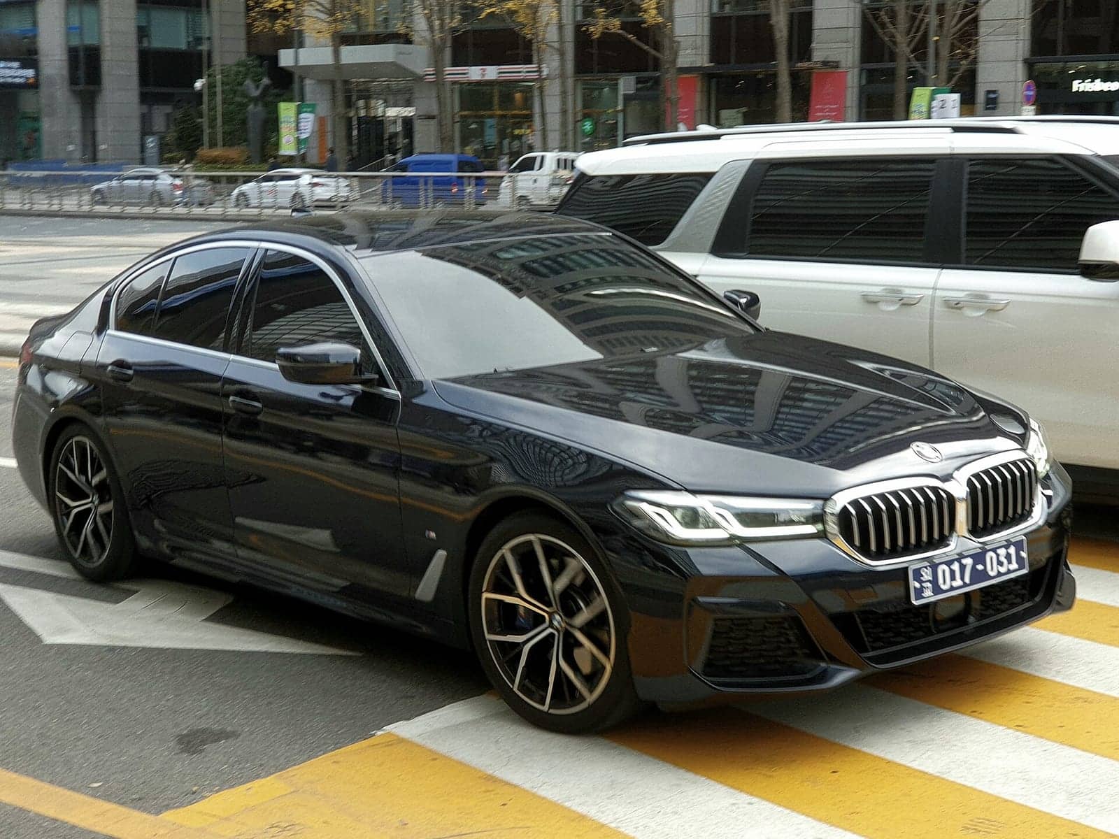 Black BMW 530i, front three-quarter view