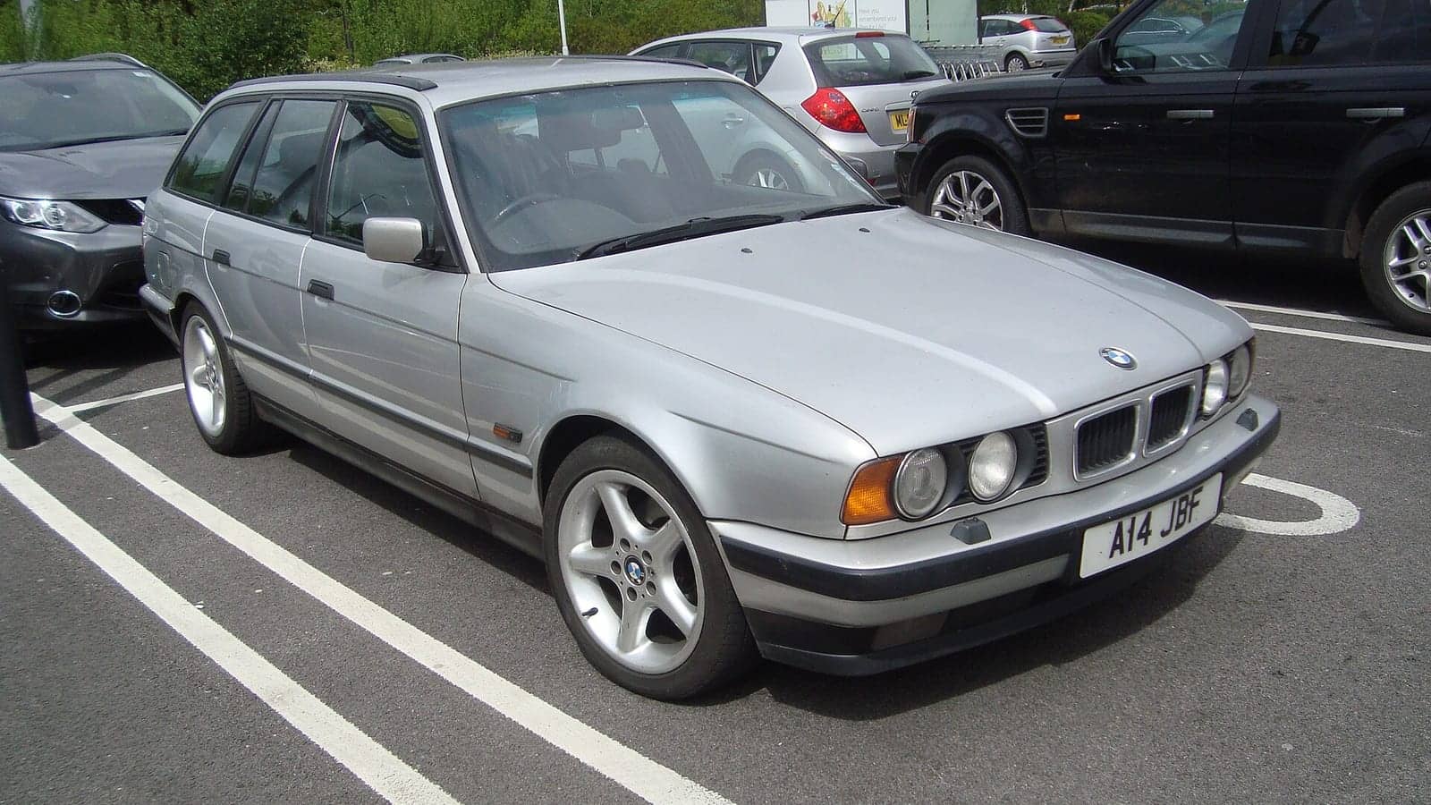 Silver BMW 530i Touring, front three-quarter view