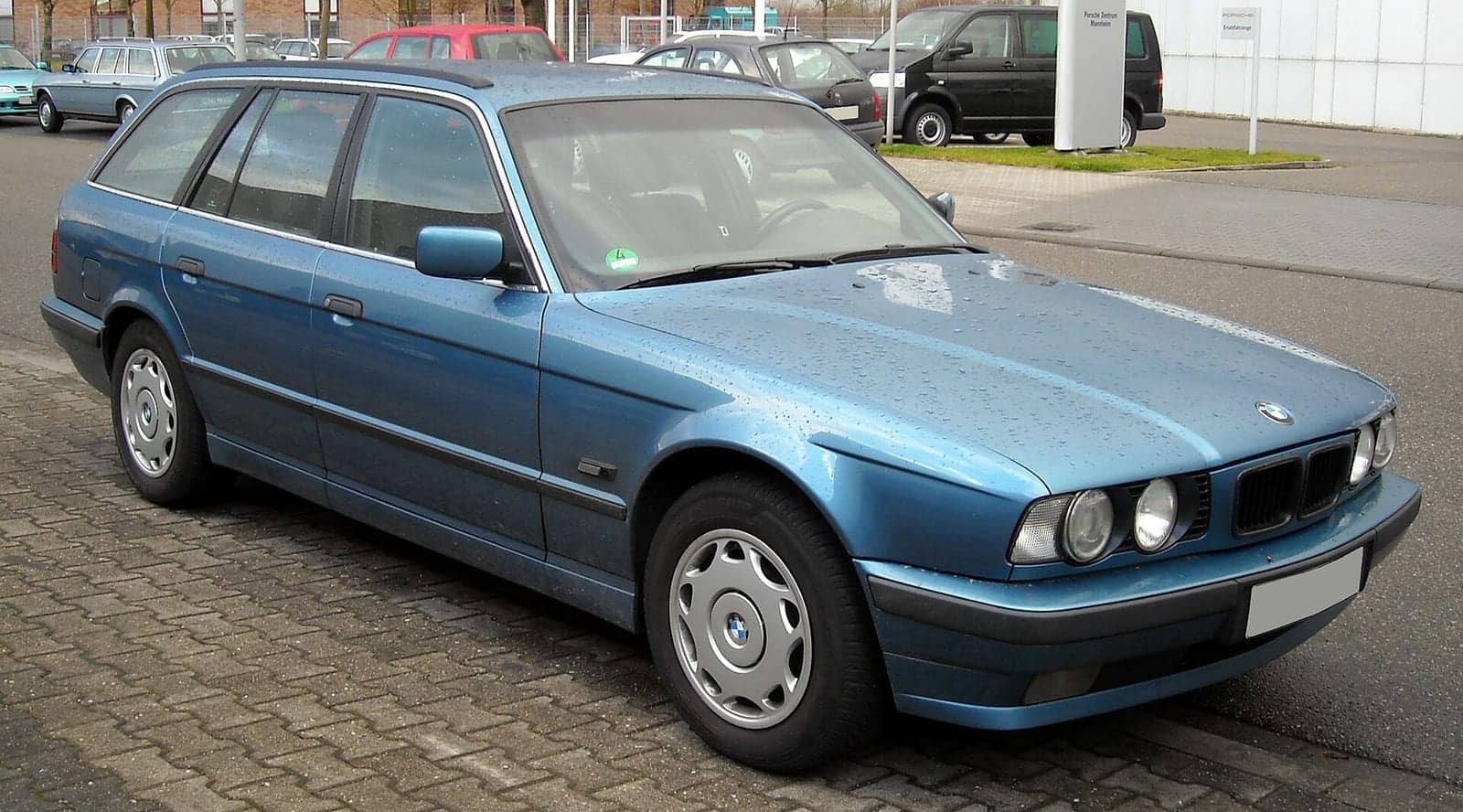 Light blue BMW 5 Series Touring (E34), front three-quarter view