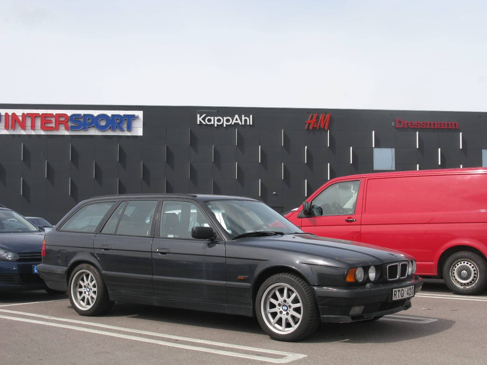Black BMW 540i Touring, side view