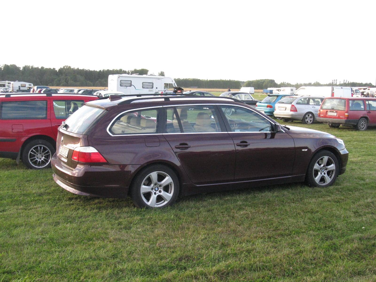 Purple BMW 525xi Touring (facelift), rear three-quarter view