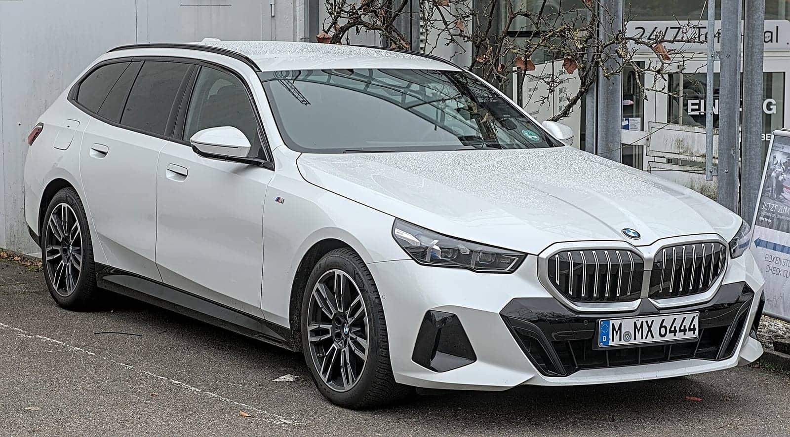 White BMW 520d Touring, front three-quarter view